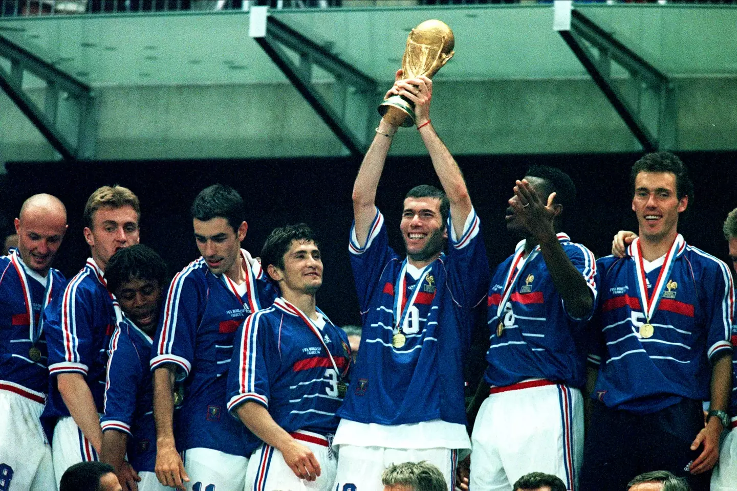 Zinedine Zidane holds aloft the World Cup after France's success in 1998. Image: Getty