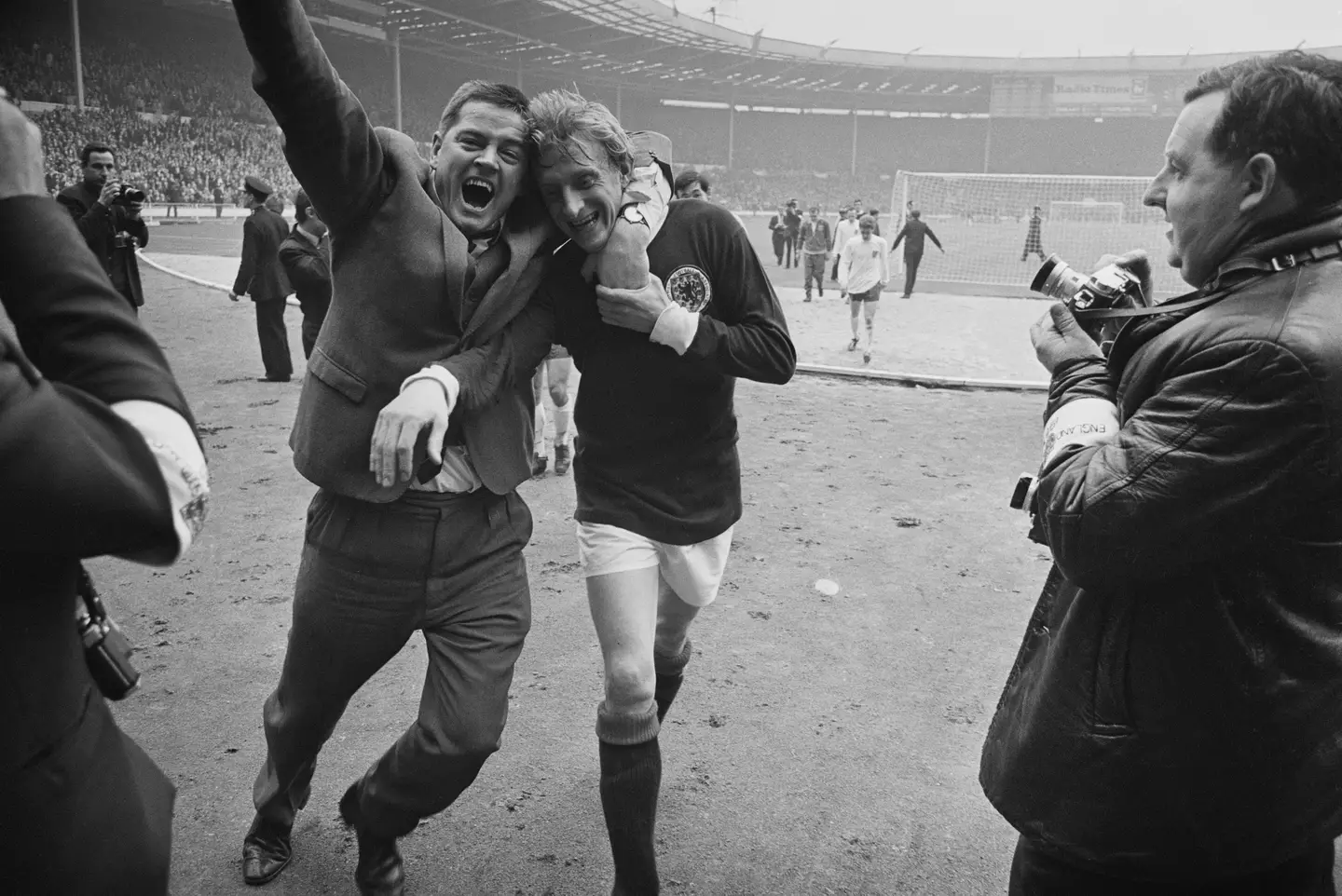 Scotland's Denis Law is hugged by a fan after they beat England in 1967. Image credit: Getty