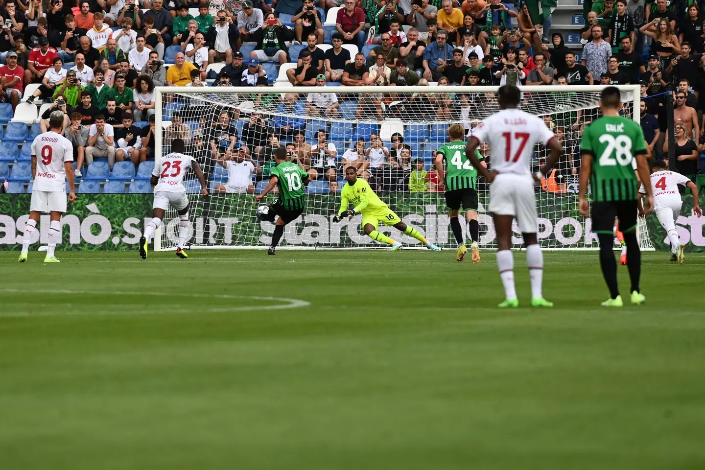 Mike Maignan saving Berardi's penalty in Serie A earlier this season. (