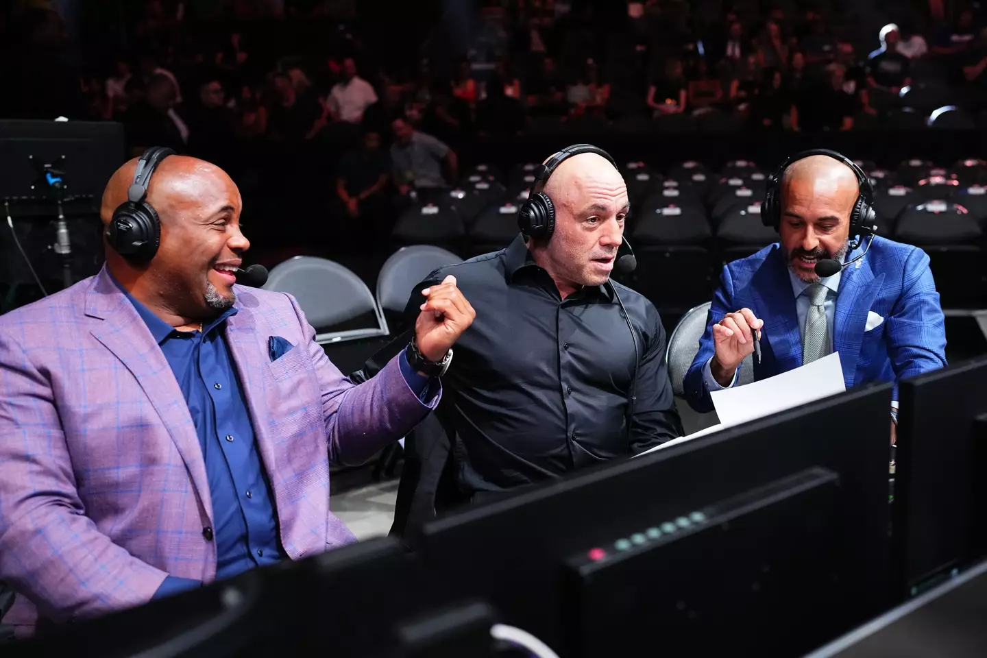 Joe Rogan in the commentary booth for UFC 303. Image: Getty