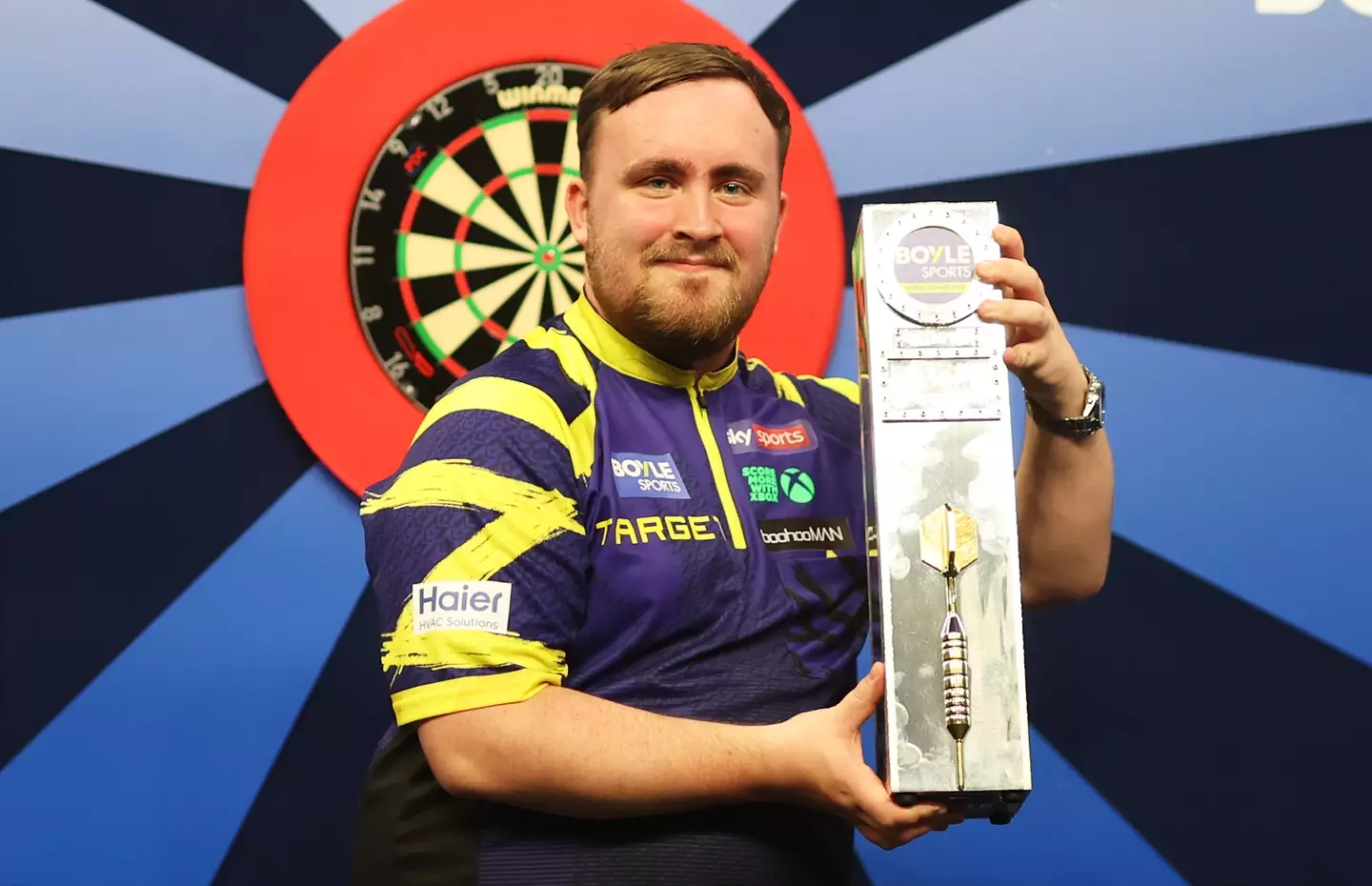 Luke Littler celebrates winning the World Grand Prix. Image: Getty