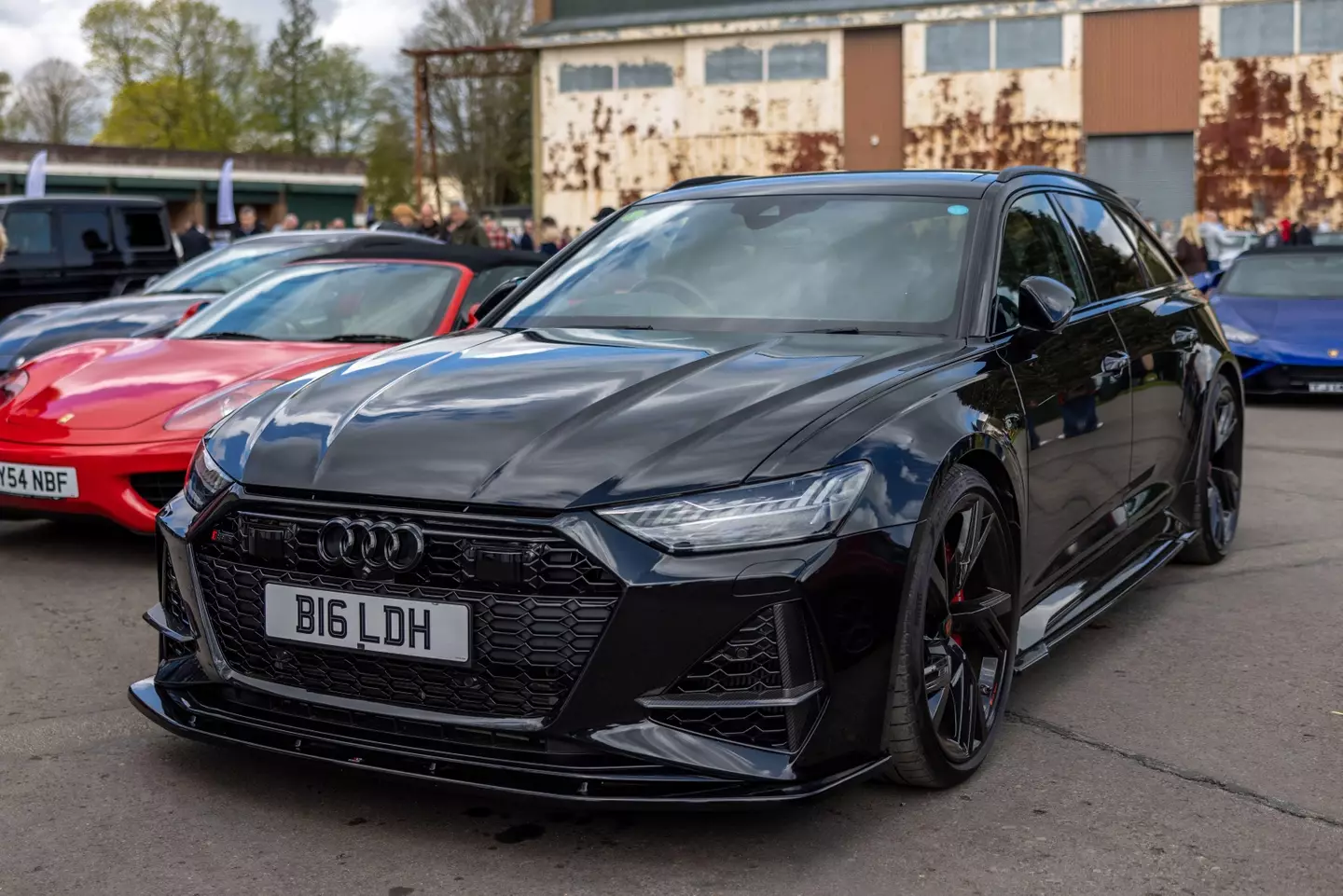 Haaland drives a Carbon Black performance model of the Audi RS6 Avant