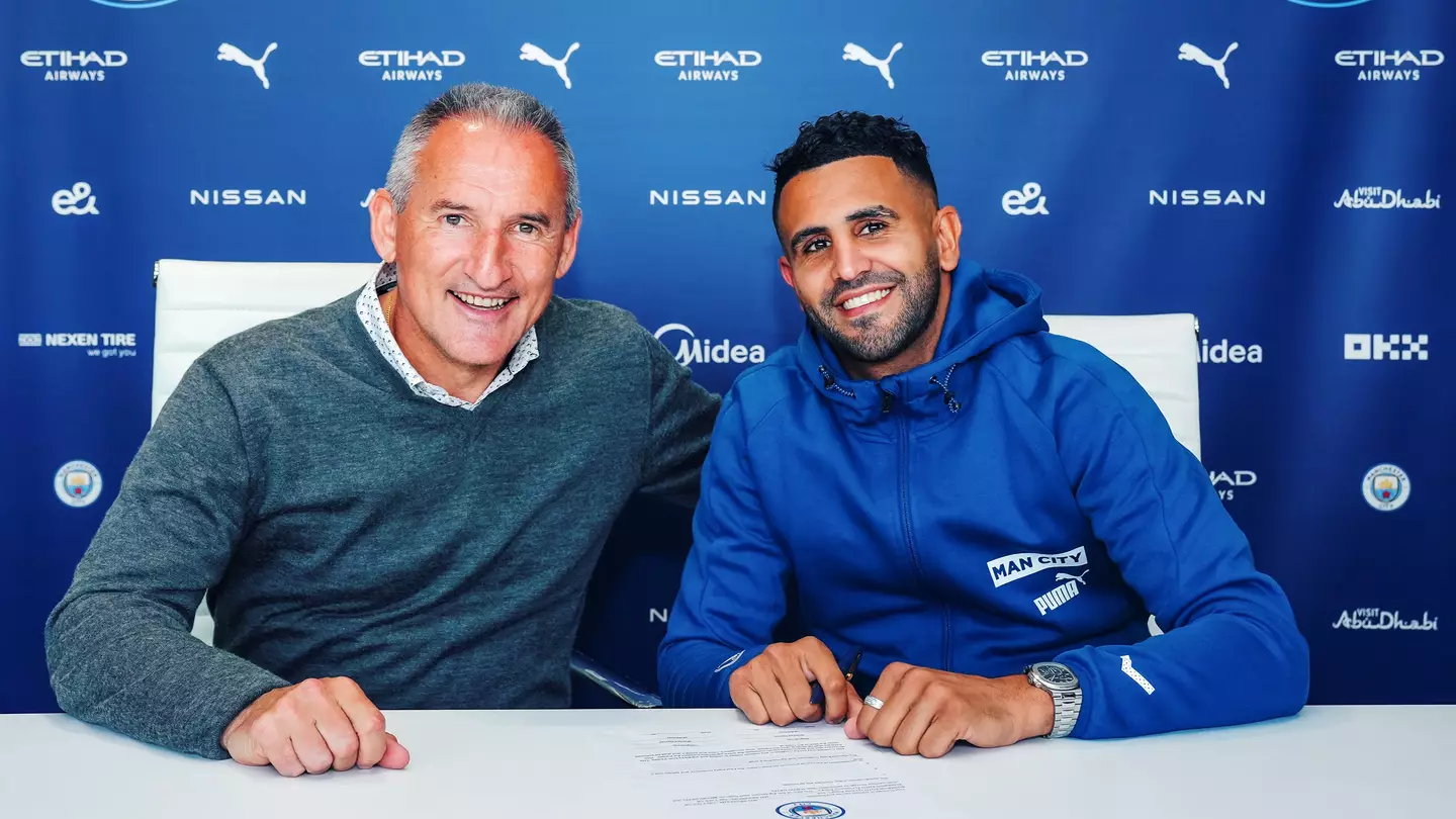 Riyad Mahrez and Txiki Begiristain signing new contract (Image: Manchester City)