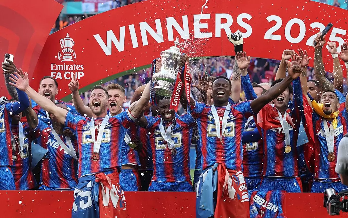 Marc Guehi (centre, right) lifted the FA Cup trophy with Crystal Palace last month (Image: Getty)