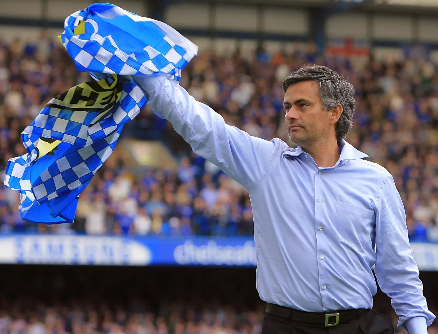 Jose Mourinho waves the Chelsea flag following win that confirmed club as champions / Photo credit ODD ANDERSEN/AFP via Getty Images