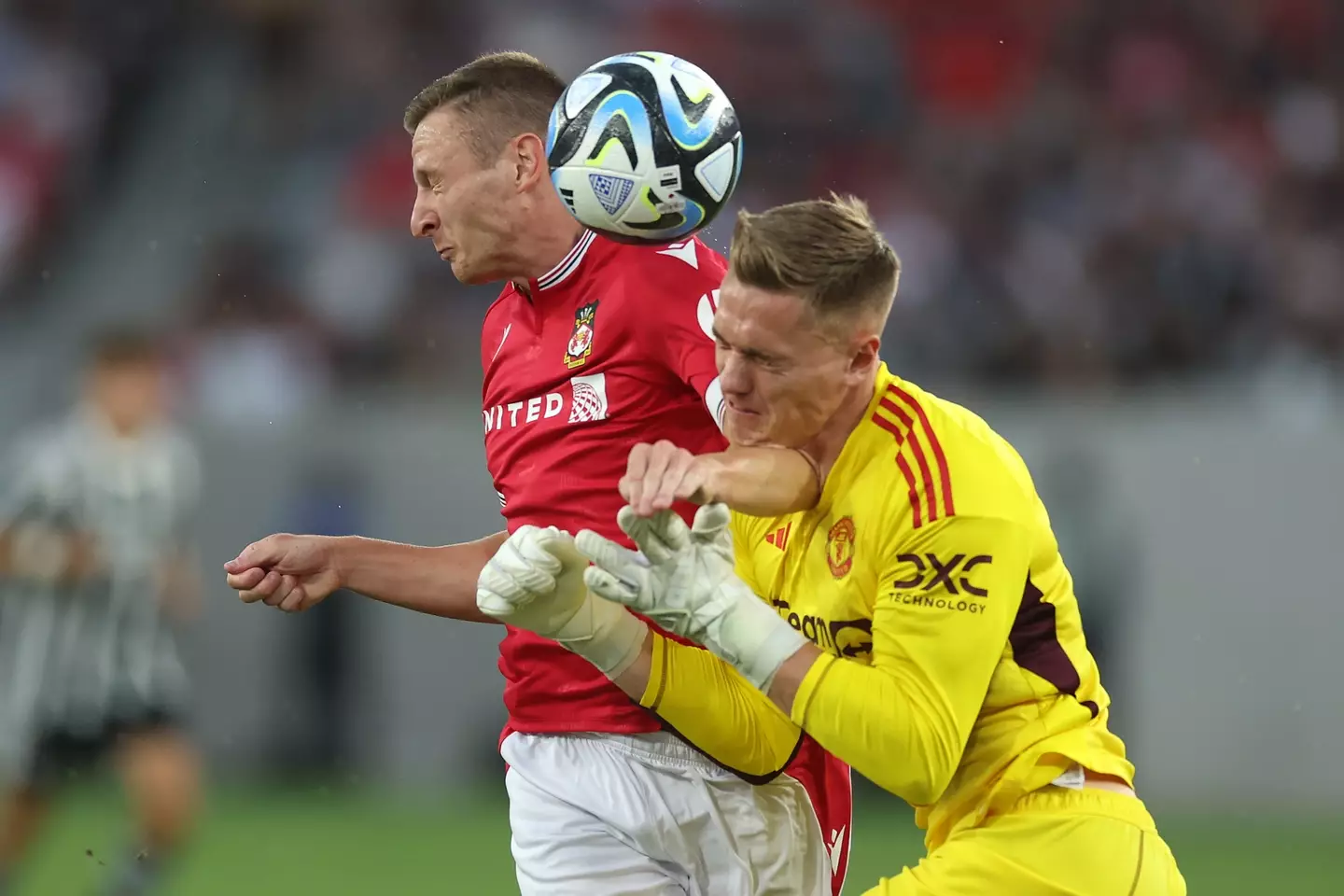 Paul Mullin and Nathan Bishop clash. Image: Getty