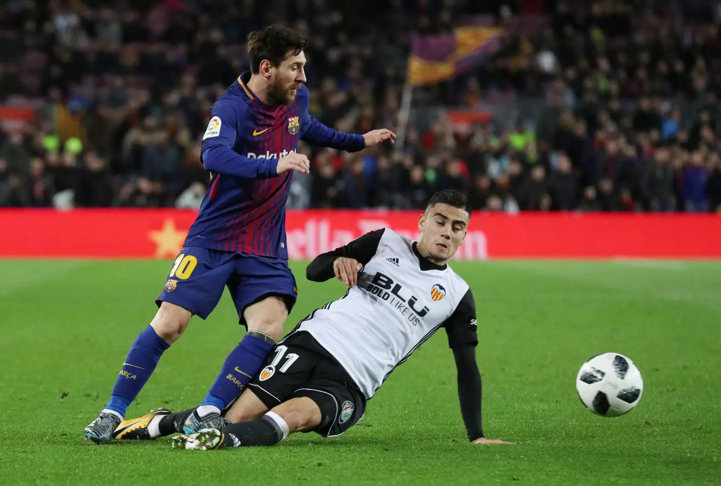 Andreas Pereira tackles Lionel Messi while on loan at Valenica. (Alamy)