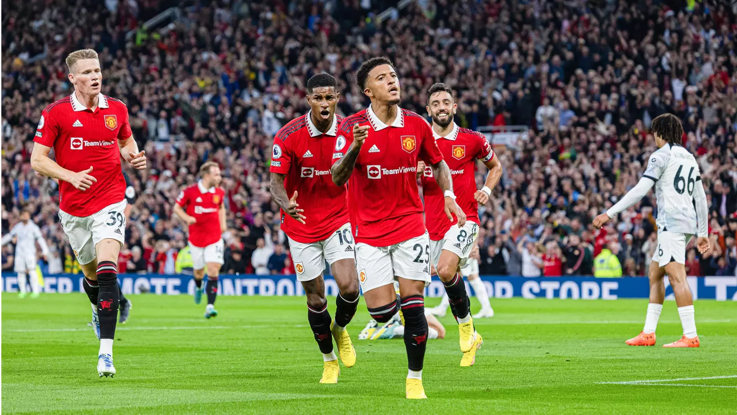 Jadon Sancho celebrates scoring against Liverpool. (Alamy)