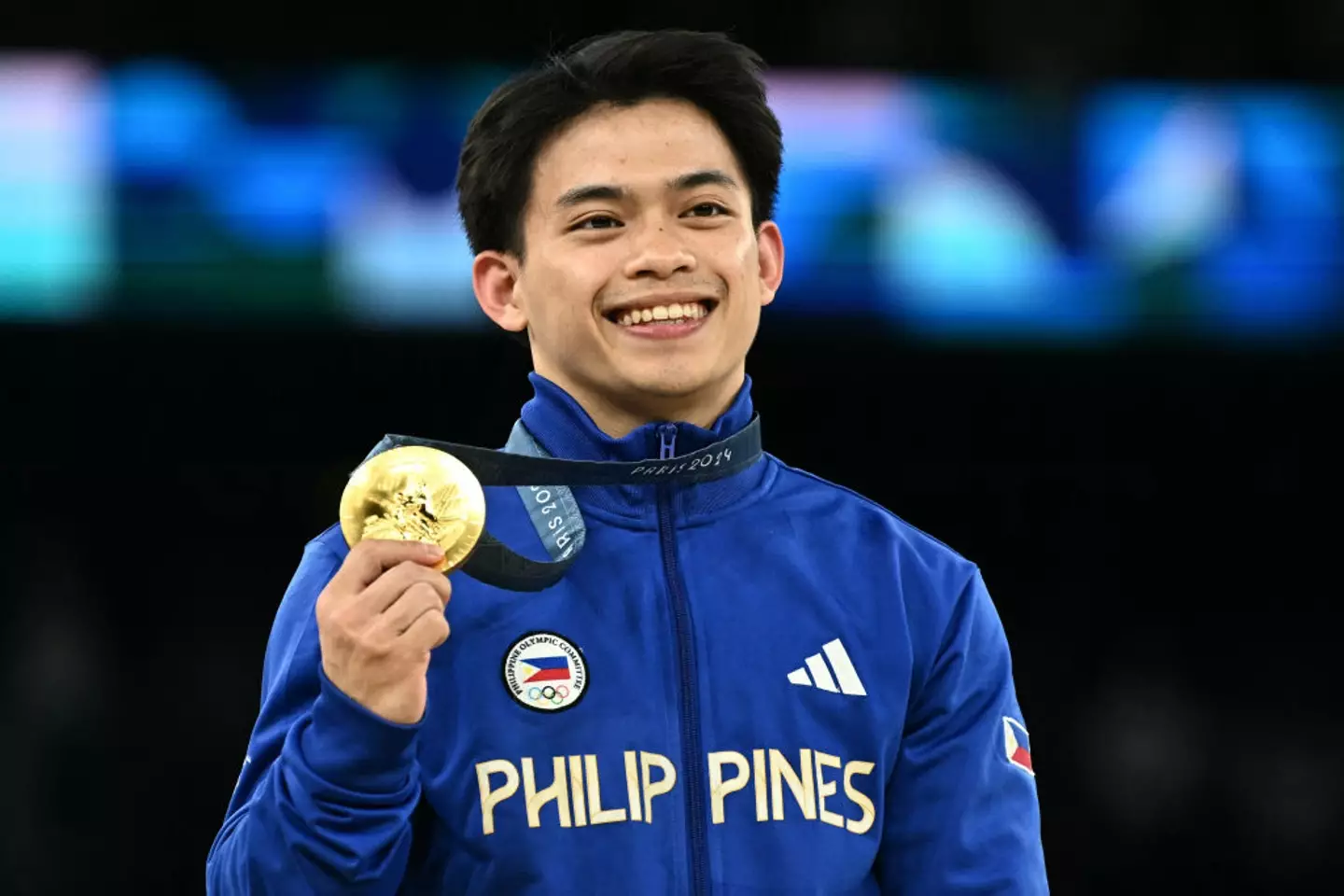 Filipino gymnast Carlos Yulo pictured after winning gold at the 2024 Olympics -
