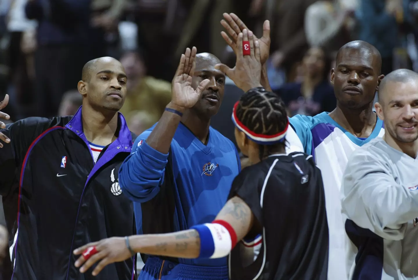 Allen Iverson of the Eastern Conference All Stars greets teammates Michael Jordan during the 2003 NBA All-Star Game. Image credit: Getty
