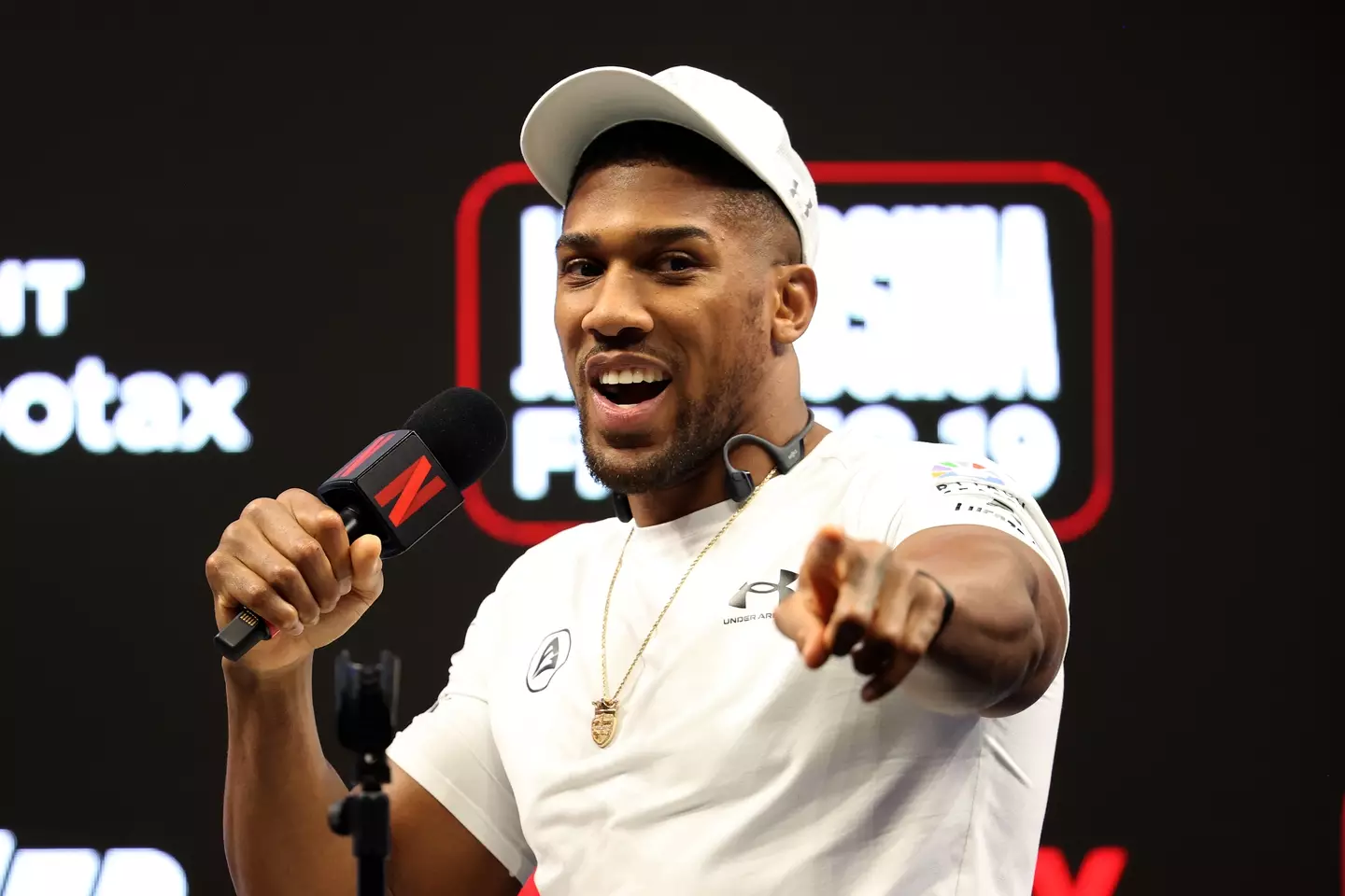Anthony Joshua speaking during a press conference for the exhibition fight (Image: Getty)