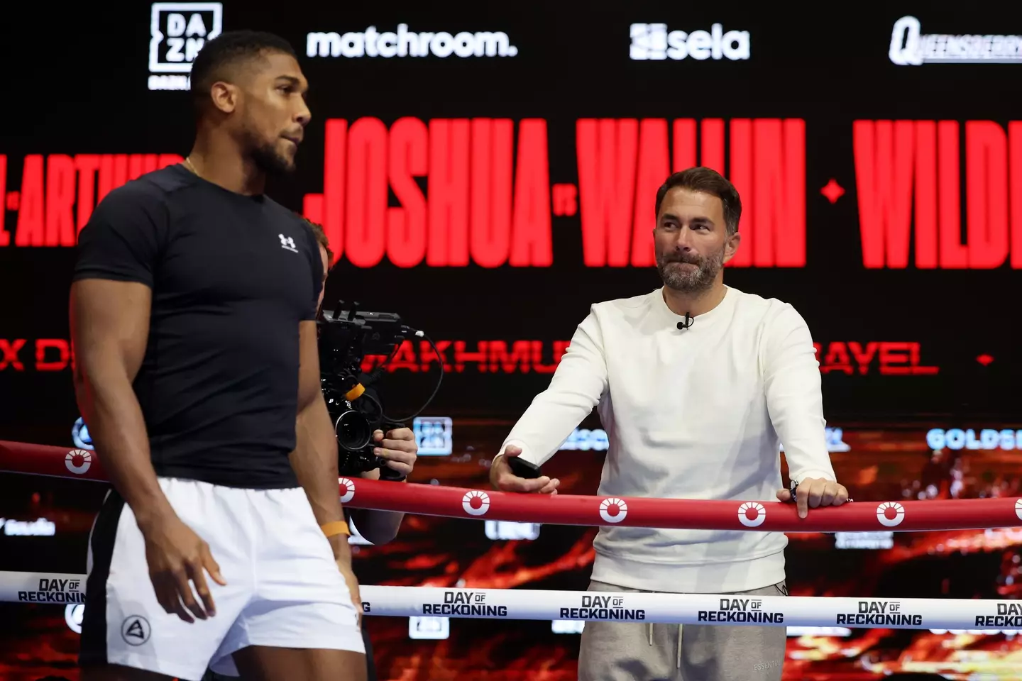 Anthony Joshua with Eddie Hearn during an open workout. Image: Getty 