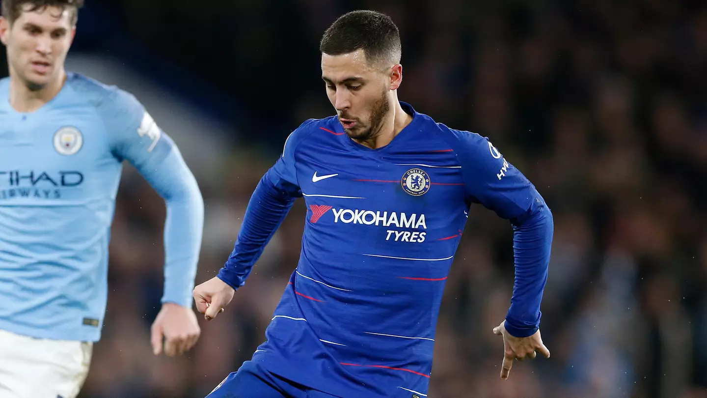 Hazard vies with Manchester City's John Stones during the Premier League match.