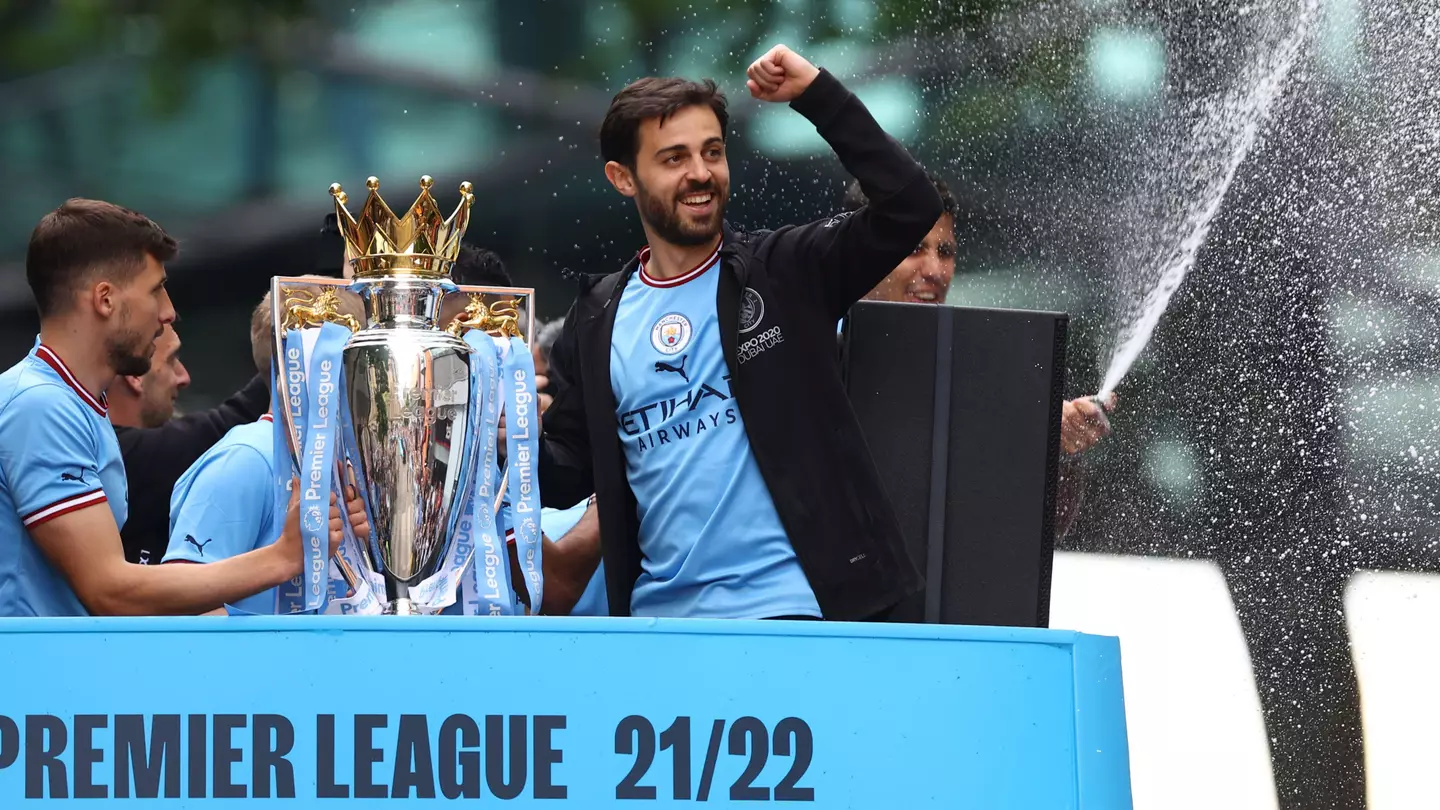 Bernardo Silva celebrates Manchester City's Premier League trophy success.