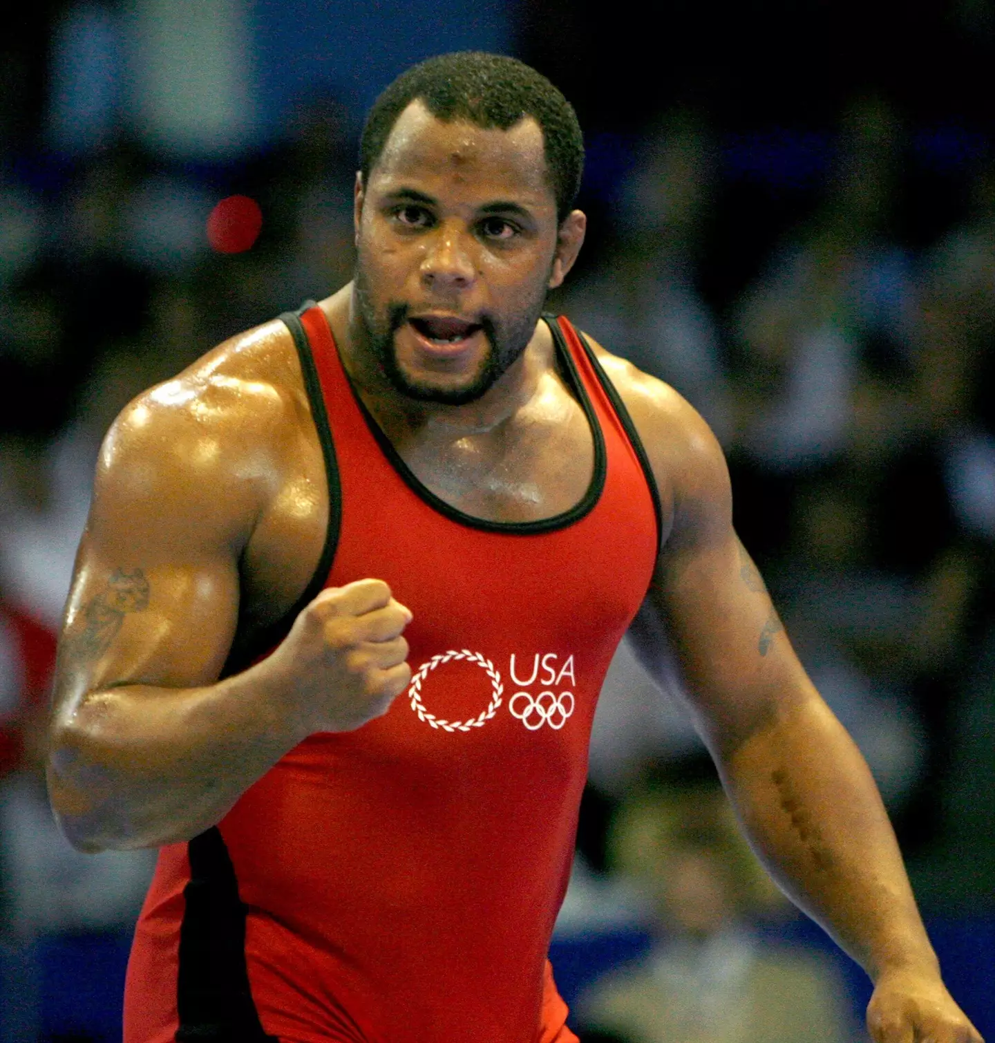 Daniel Cormier celebrates winning a bronze medal during the men's Free Style 96kg finals at the Senior Wrestling World Championship in Baku September 21, 2007. Image credit: Alamy