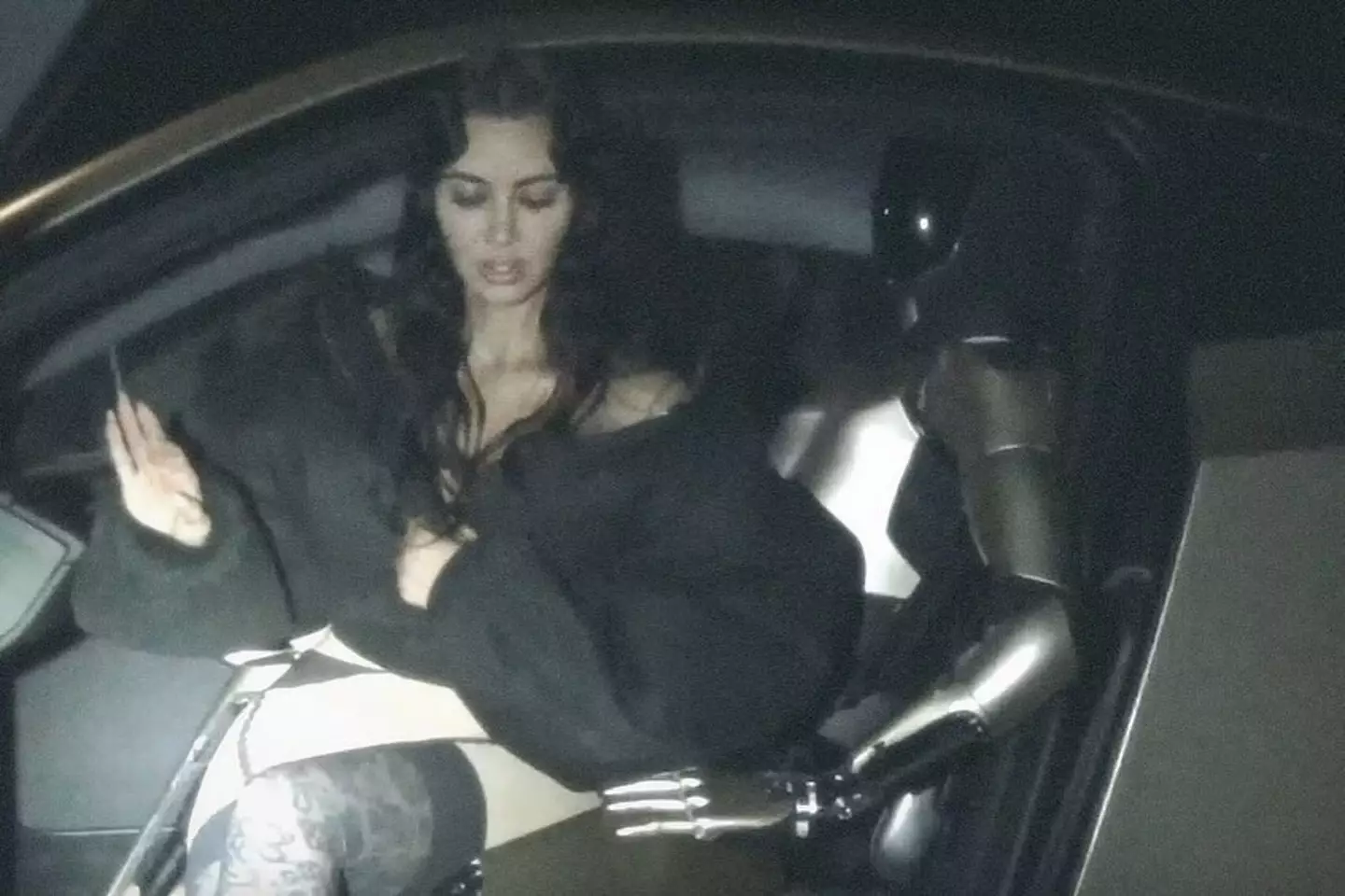 Kim Kardashian posed sitting in the robot's lap (Instagram/@kimkardashian)