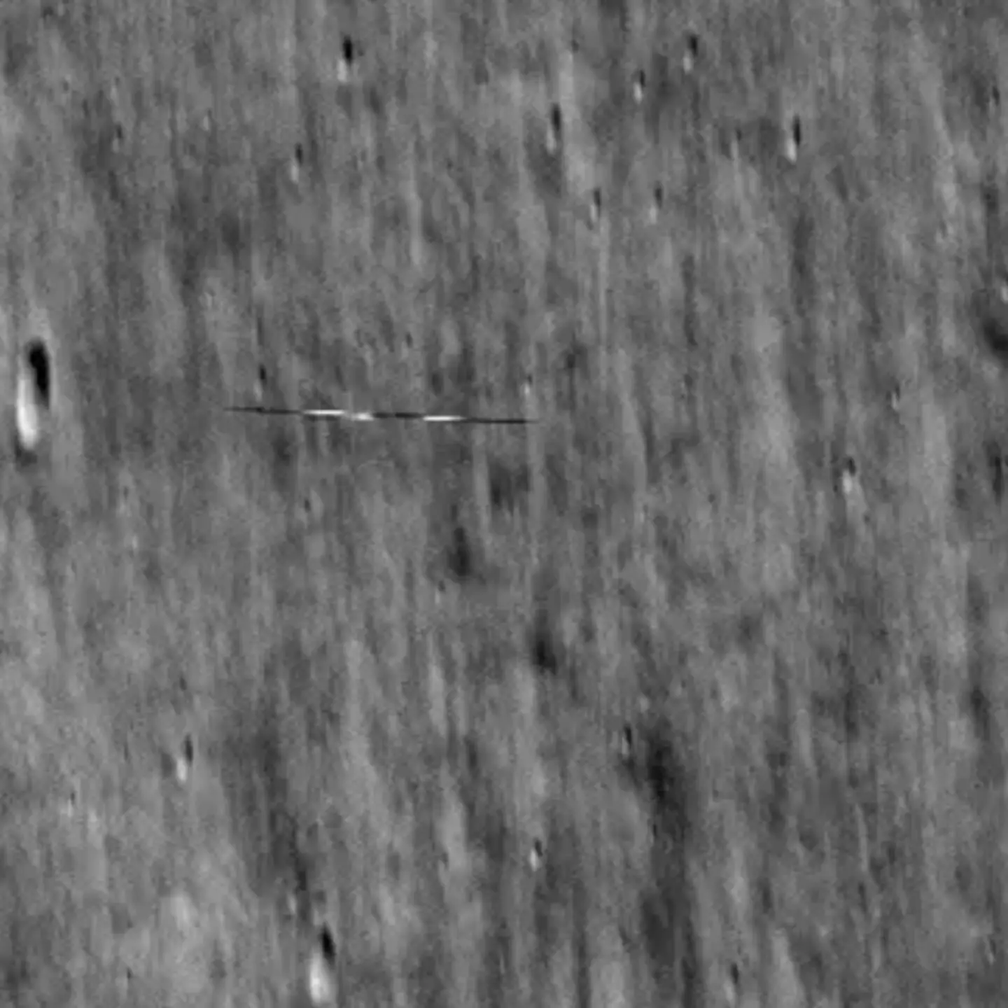 Mysterious bullet-shaped object spotted orbiting the moon in NASA pic
