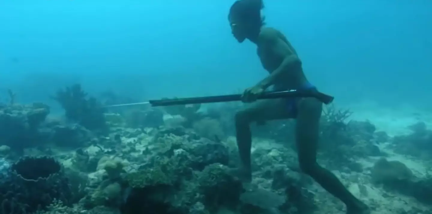 The man is filmed walking along the sea floor (BBC)