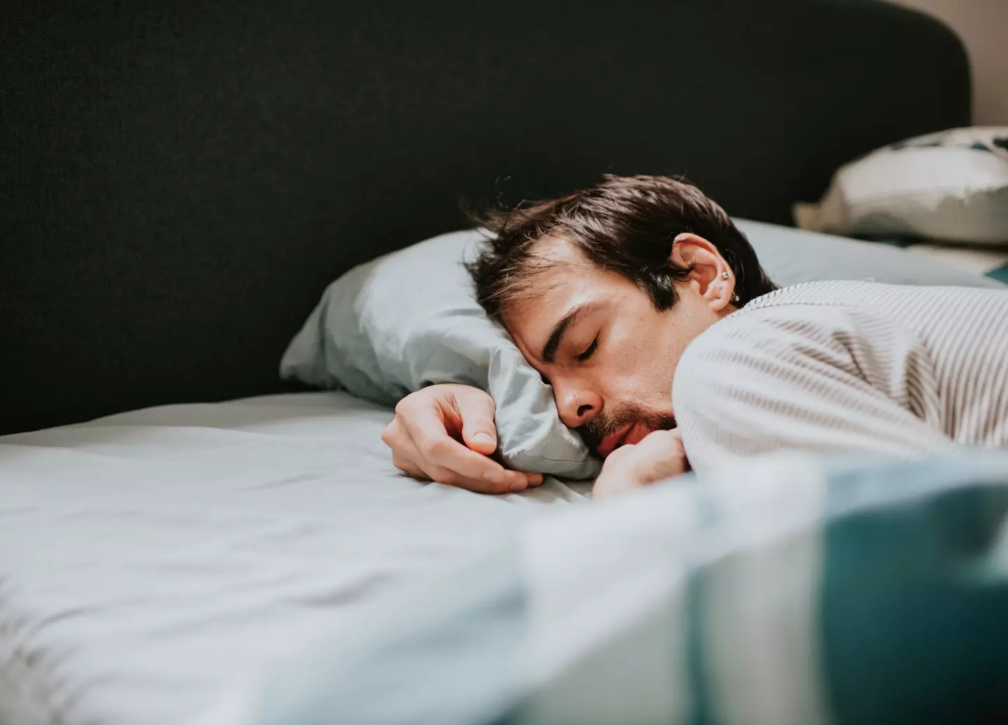 Cotton pillowcases have been shown to harbor far more bacteria, which can contribute to accelerated ageing signs and acne issues (Getty Stock)