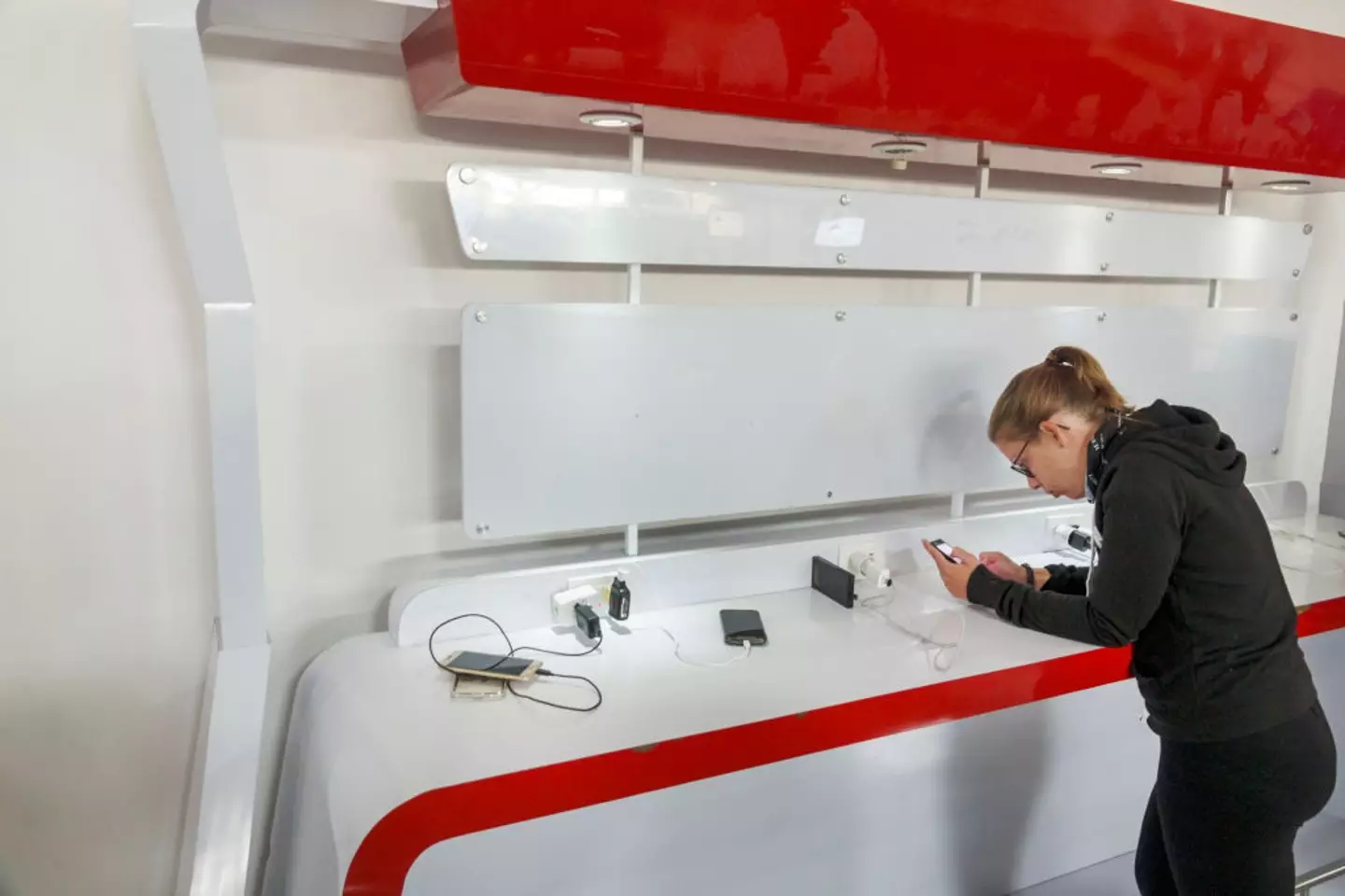 A woman using a charging station at Rafael Nunez International Airport (Getty Images)