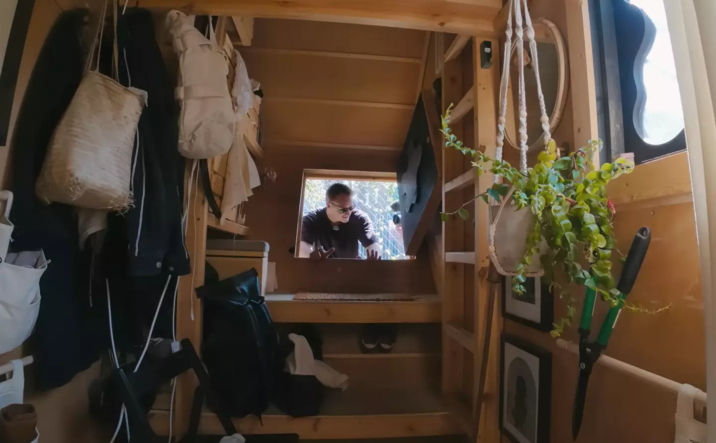 Harrison lives on top of a literal dumpster. (Drew Binsky/YouTube)