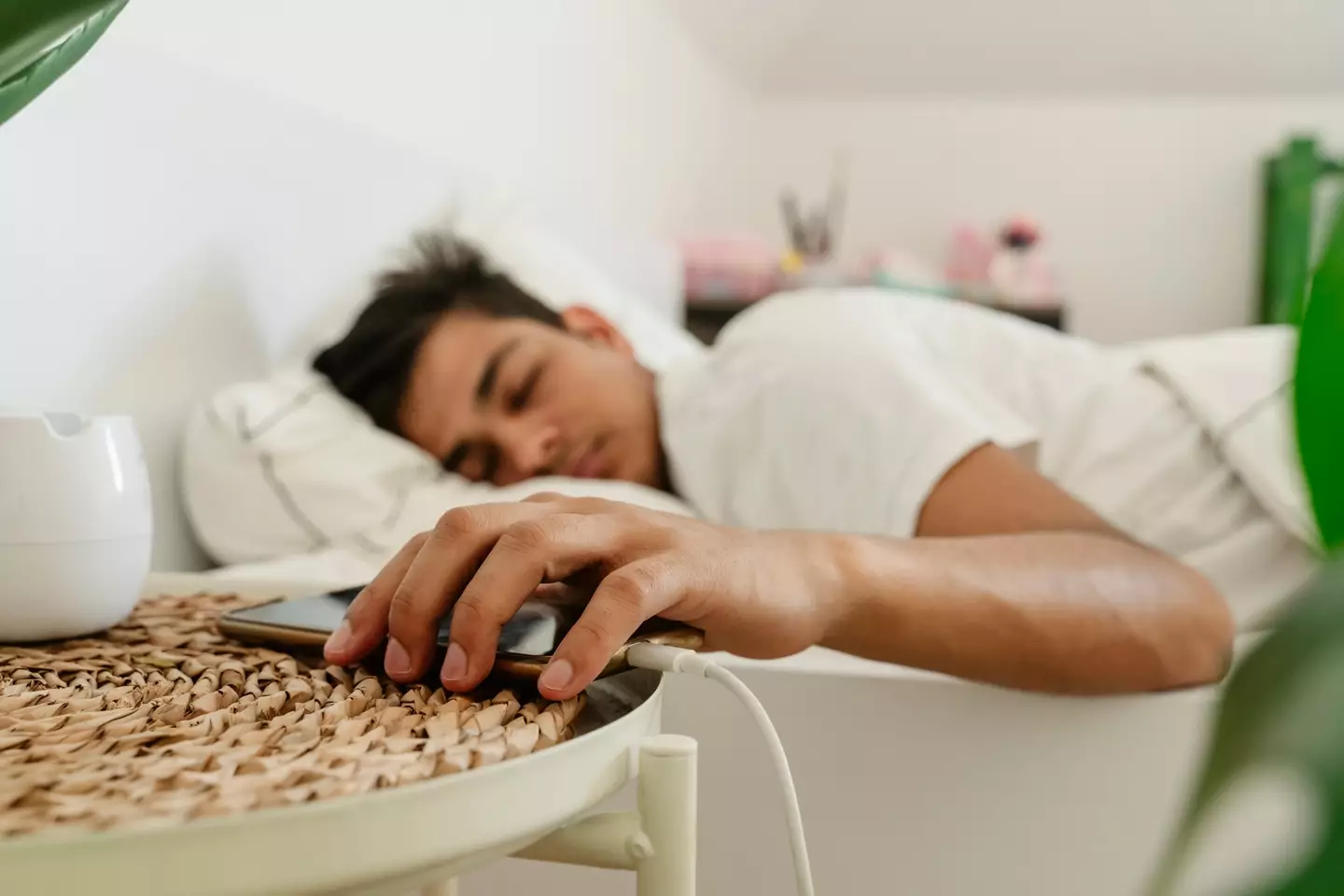 iPhone users can turn on white noise to get a better night's sleep. (Westend61/Getty)