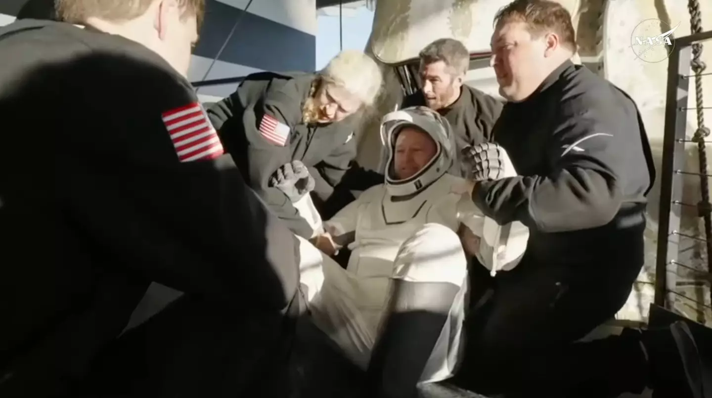 Williams and Wimore were helped onto stretchers before being whisked away (NASA)