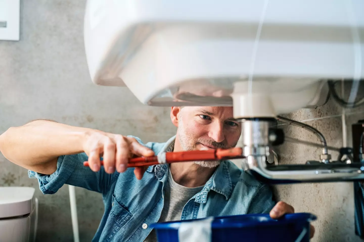 Plumbers and other manual jobs are the safest (Guido Mieth / Getty)