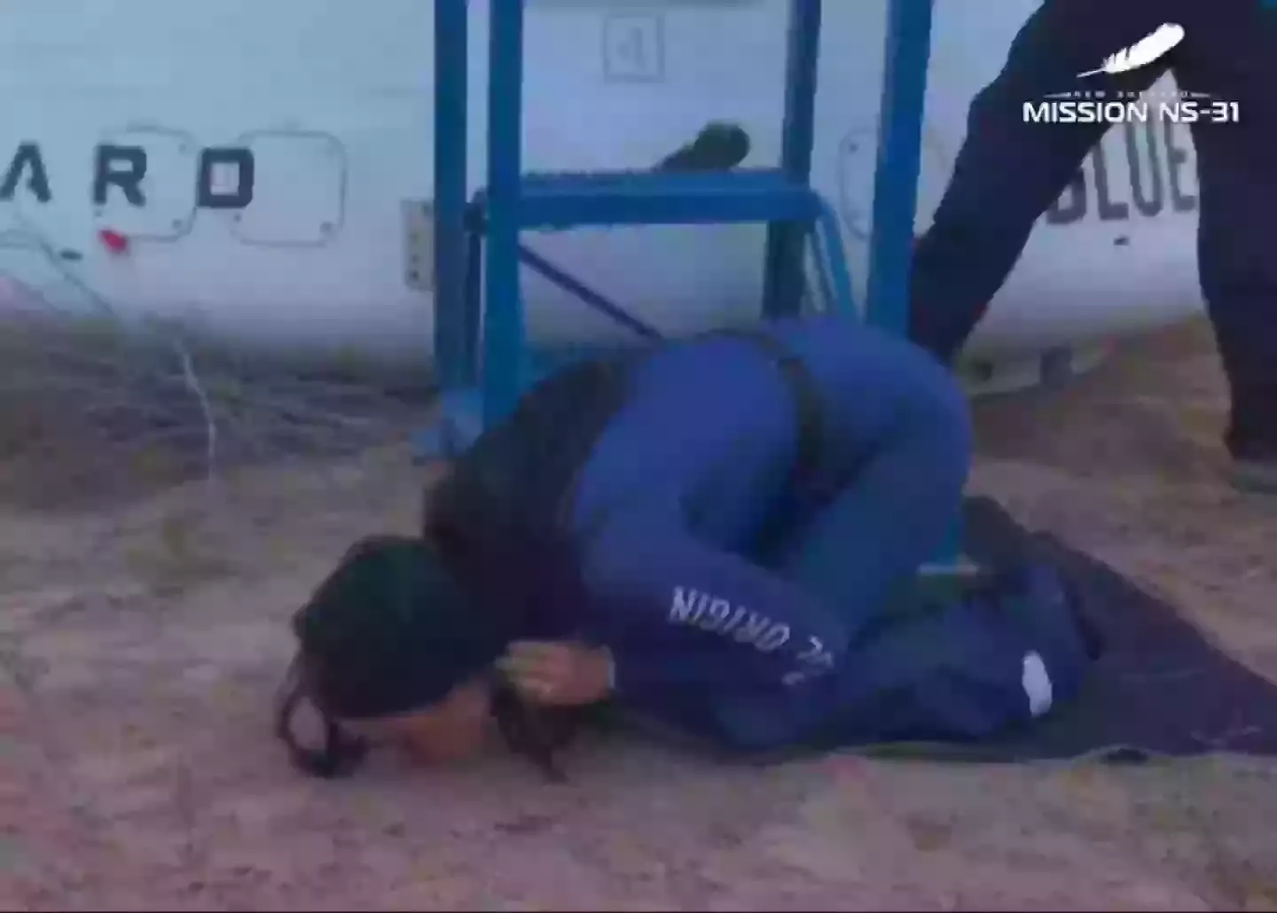 After stepping off the rocket, Perry dropped to her knees and kissed the ground. (Blue Origin)