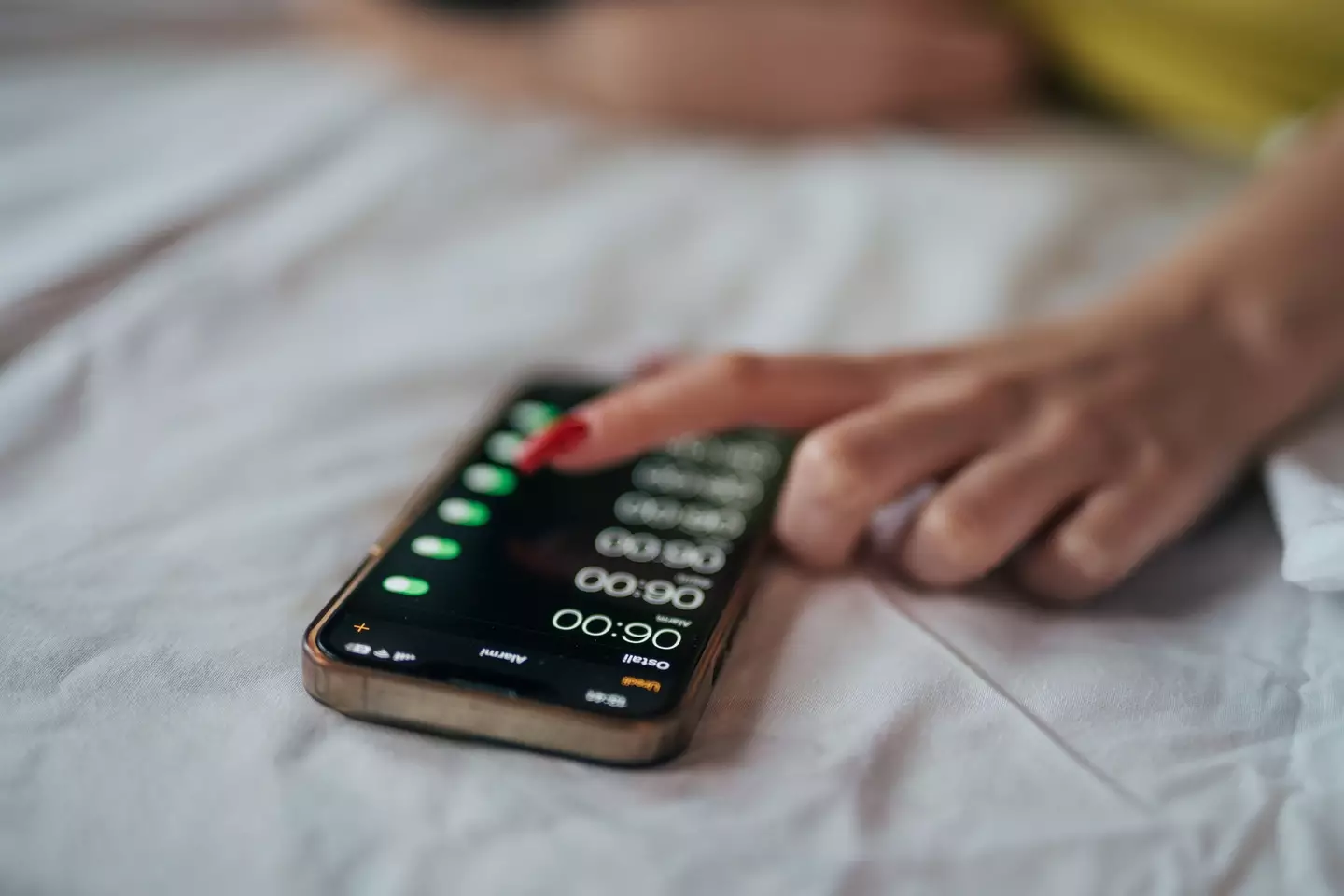 There's a reason why the snooze button lasts nine minutes (milorad kravic/Getty Images)