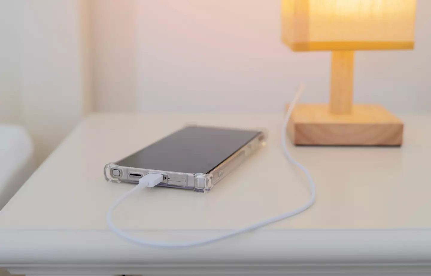 Charging your phone during the night has an unexpected risk (Getty Stock)