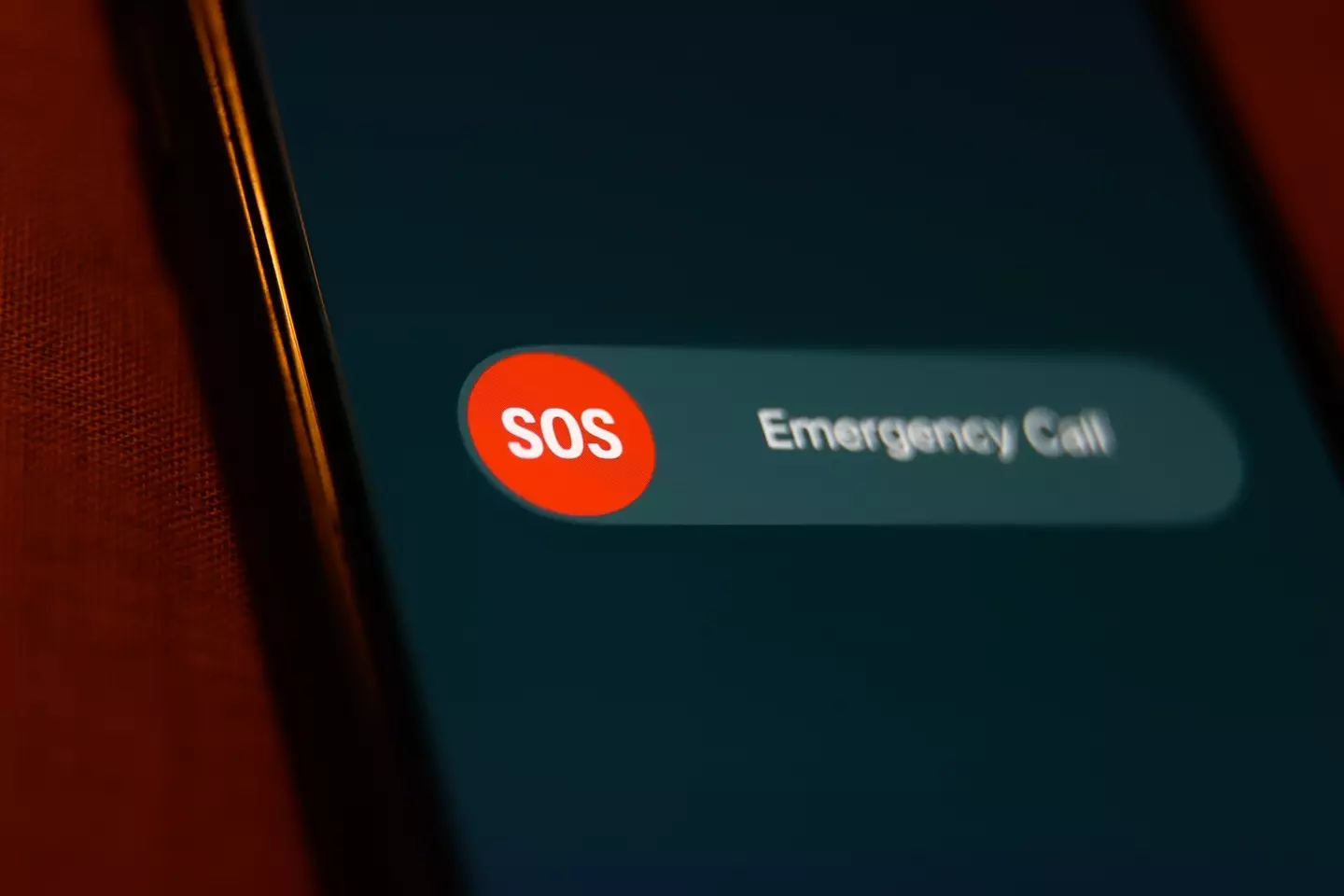 The lock button could call emergency services for you (Jakub Porzycki/NurPhoto via Getty Images)
