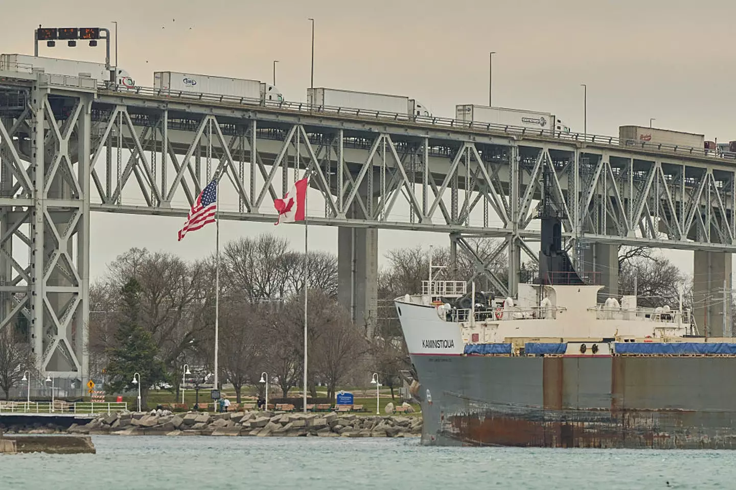 Large freighter ships constantly go up and down the St Clair River, calculating the precise and close distance they can get to the river's floor (Geoff Robins/AFP via Getty Images)