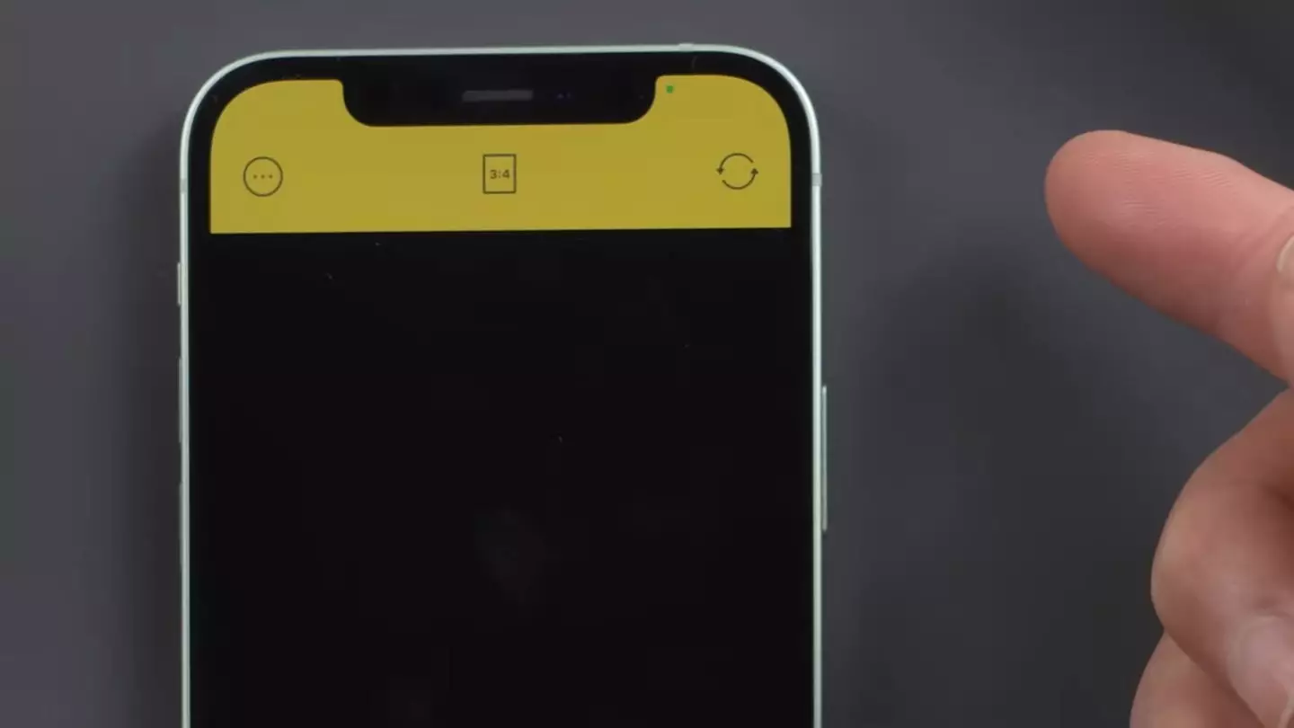 A green or orange dot at the top of your iPhone indicates that an app is using your camera or microphone (YouTube/TenorshareOfficial)