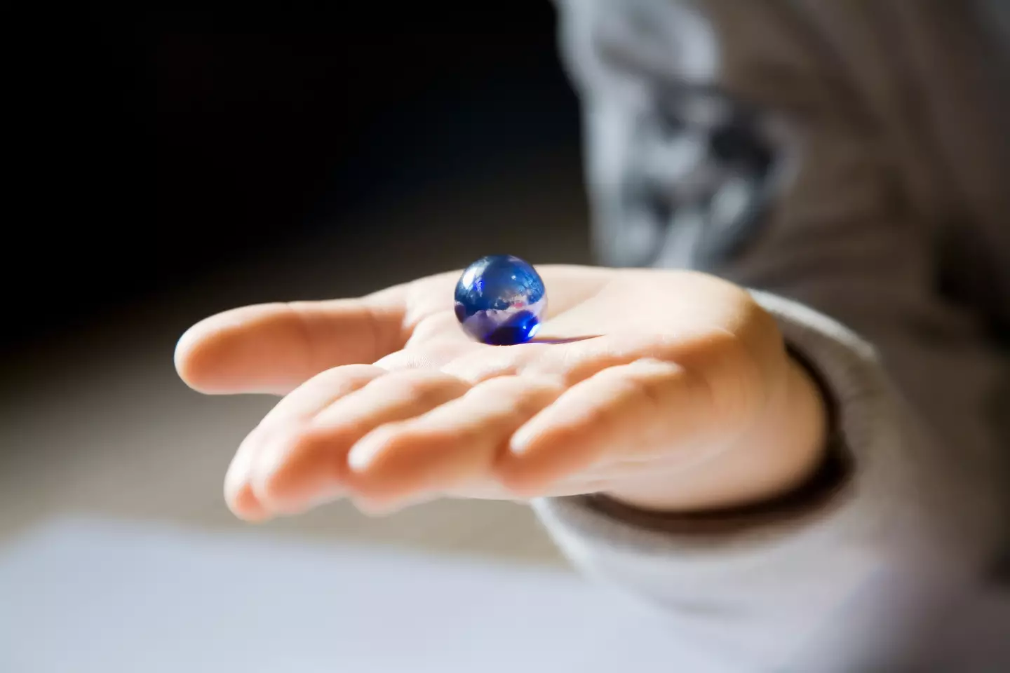 A false vacuum is a marble in a bowl on a stool, whereas the true vacuum would see the marble toppled to the floor (Getty Stock)