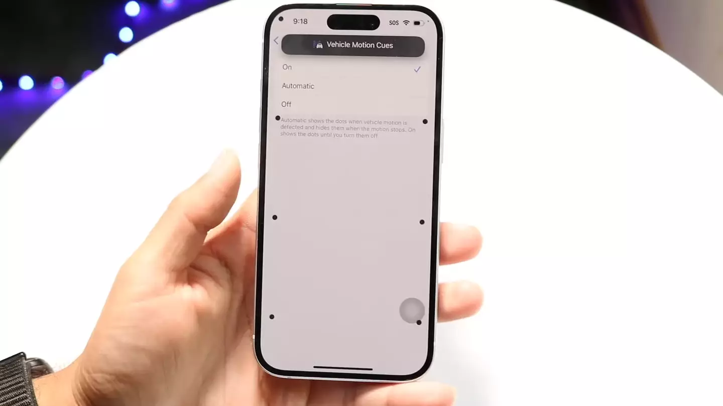 Turning on Vehicle Motion Cues puts dynamic dots around your iPhone screen that respond to the movement of a car (YouTube/LoFi Alpaca)