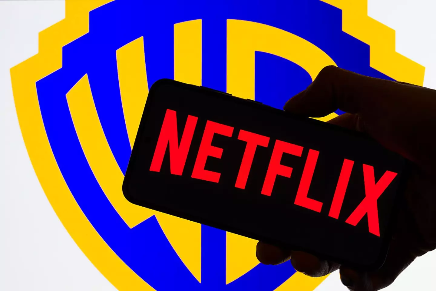 Warner Bros. Discovery is still siding with Netflix (NurPhoto / Contributor / Getty)