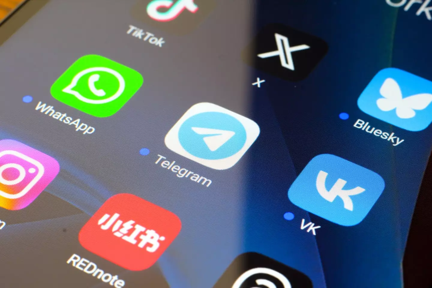 Private messaging apps like WhatsApp and Telegram have built-in functions that help with cheating (Thomas Fuller/SOPA Images/LightRocket via Getty Images)