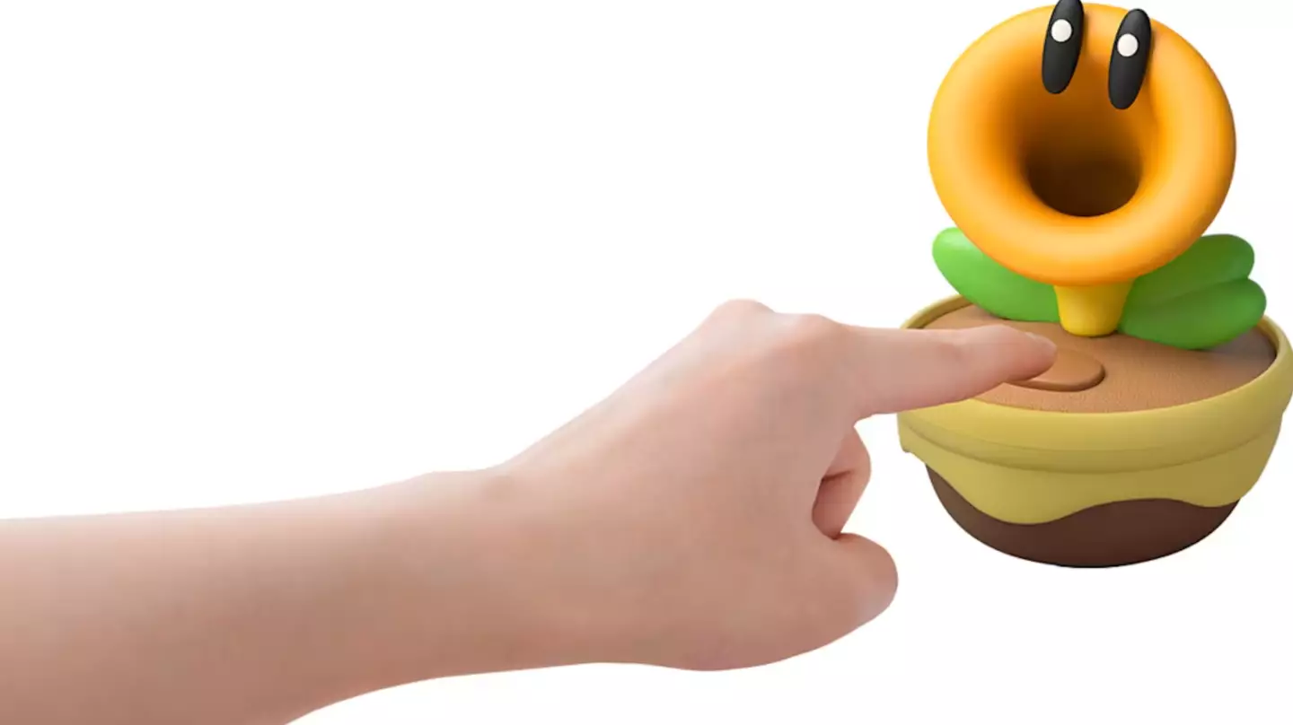 An official promo image of someone poking the Talking Flower, Nintendo