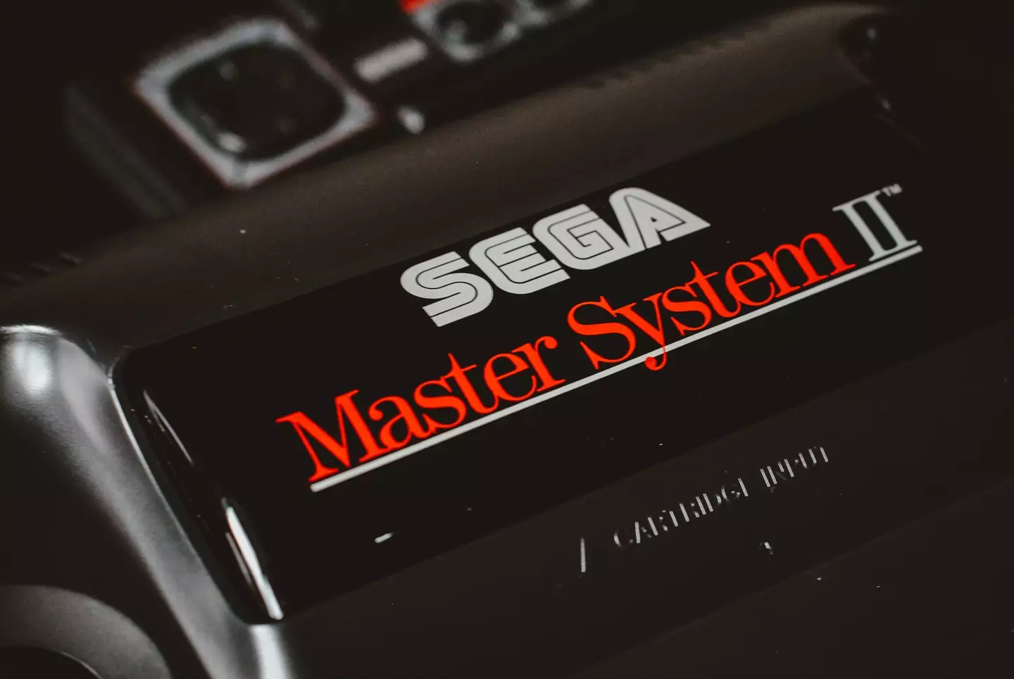 The SEGA Master System II, the model that followed the original design (pictured, main) /