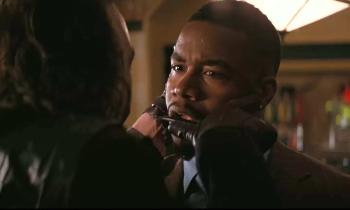 The Joker (Heath Ledger) decides to dispatch Gotham gangster Gambol (Michael Jai White) in The Dark Knight.