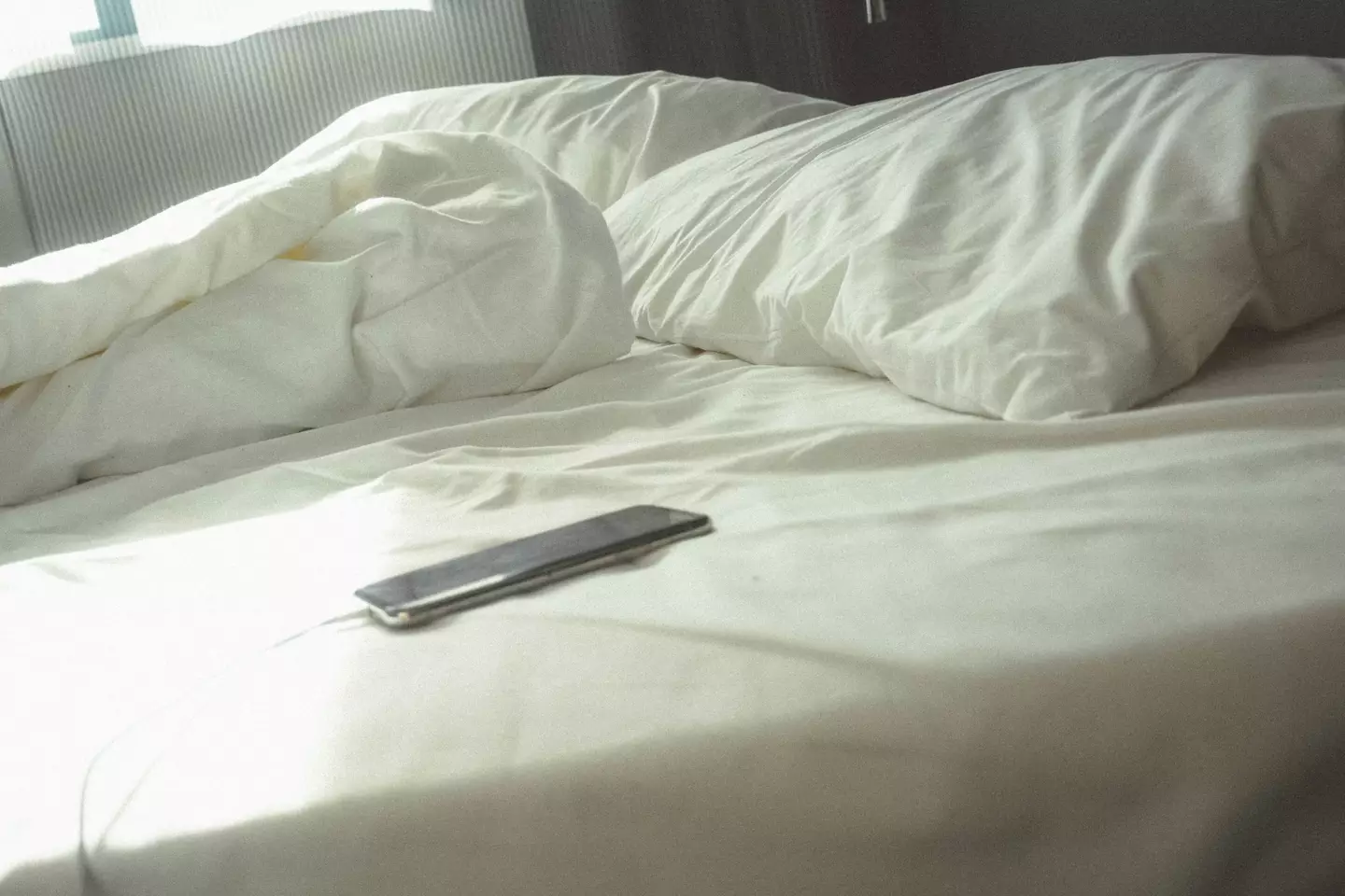 Apple have issued a warning to iPhone users who charge their phones under their pillows as they sleep.