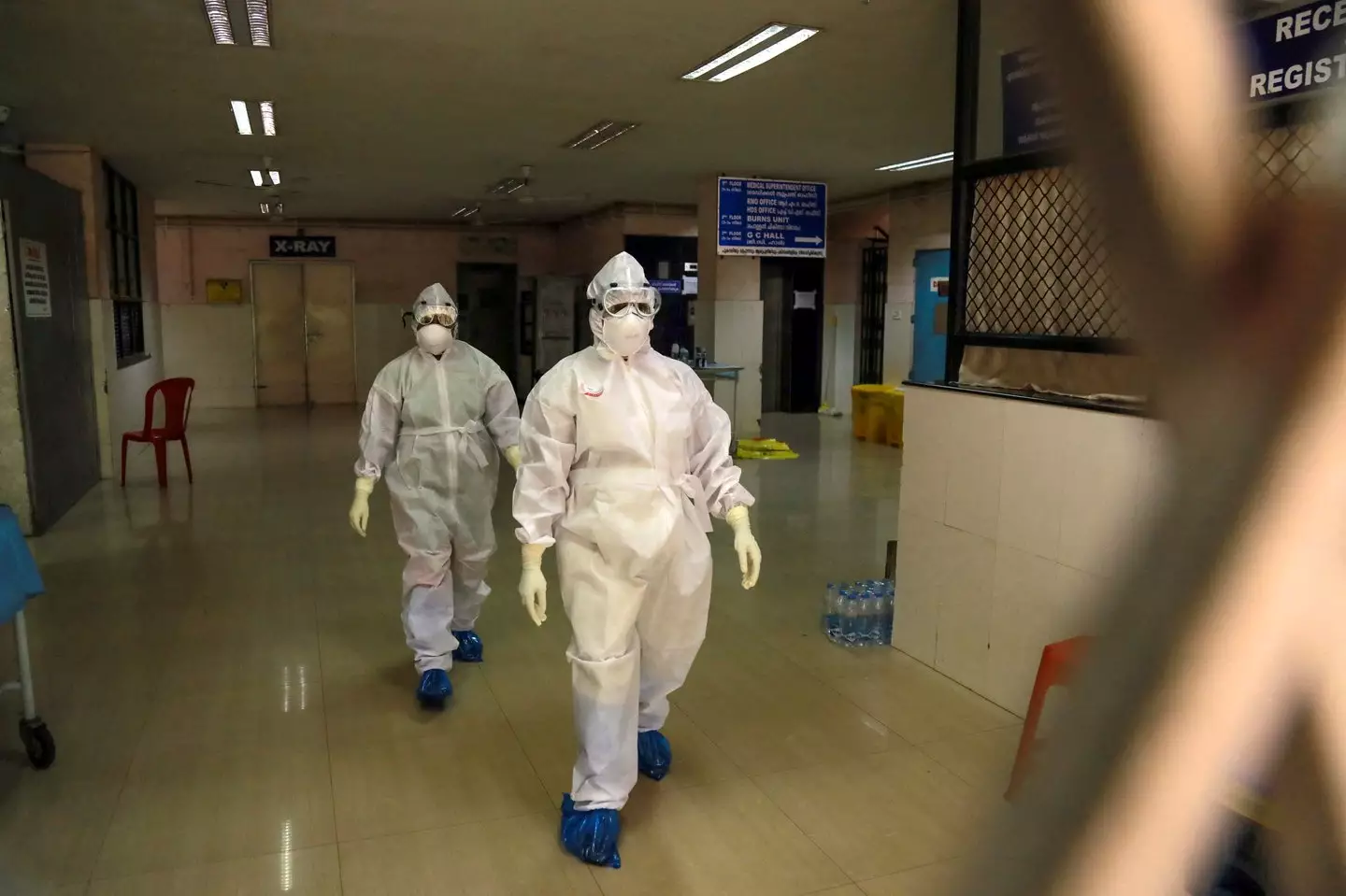 Indian health officials pictured in full protective gear during a 2019 outbreak in Kerala (STR/AFP via Getty Images)