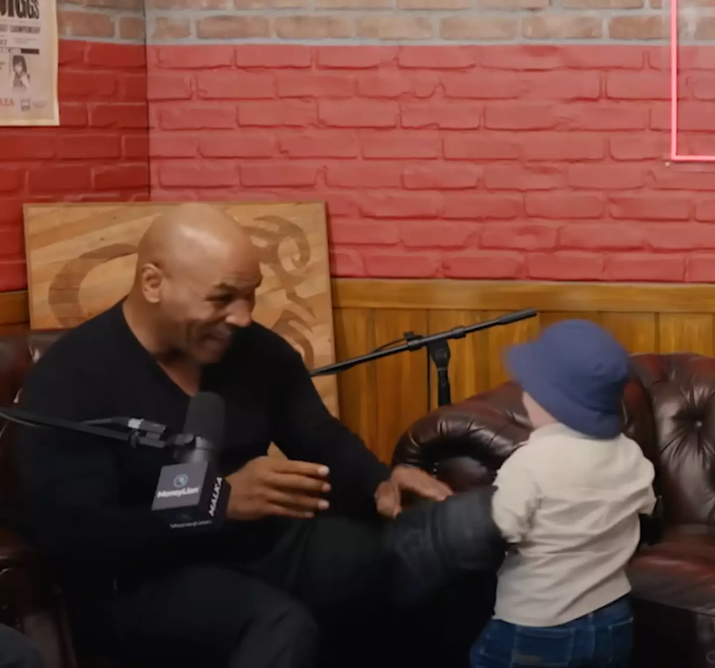 At first they were playfighting, and Mike Tyson admitted he didn't know how old Hasbulla was at the time. (YouTube / HotboxinwithMikeTyson)