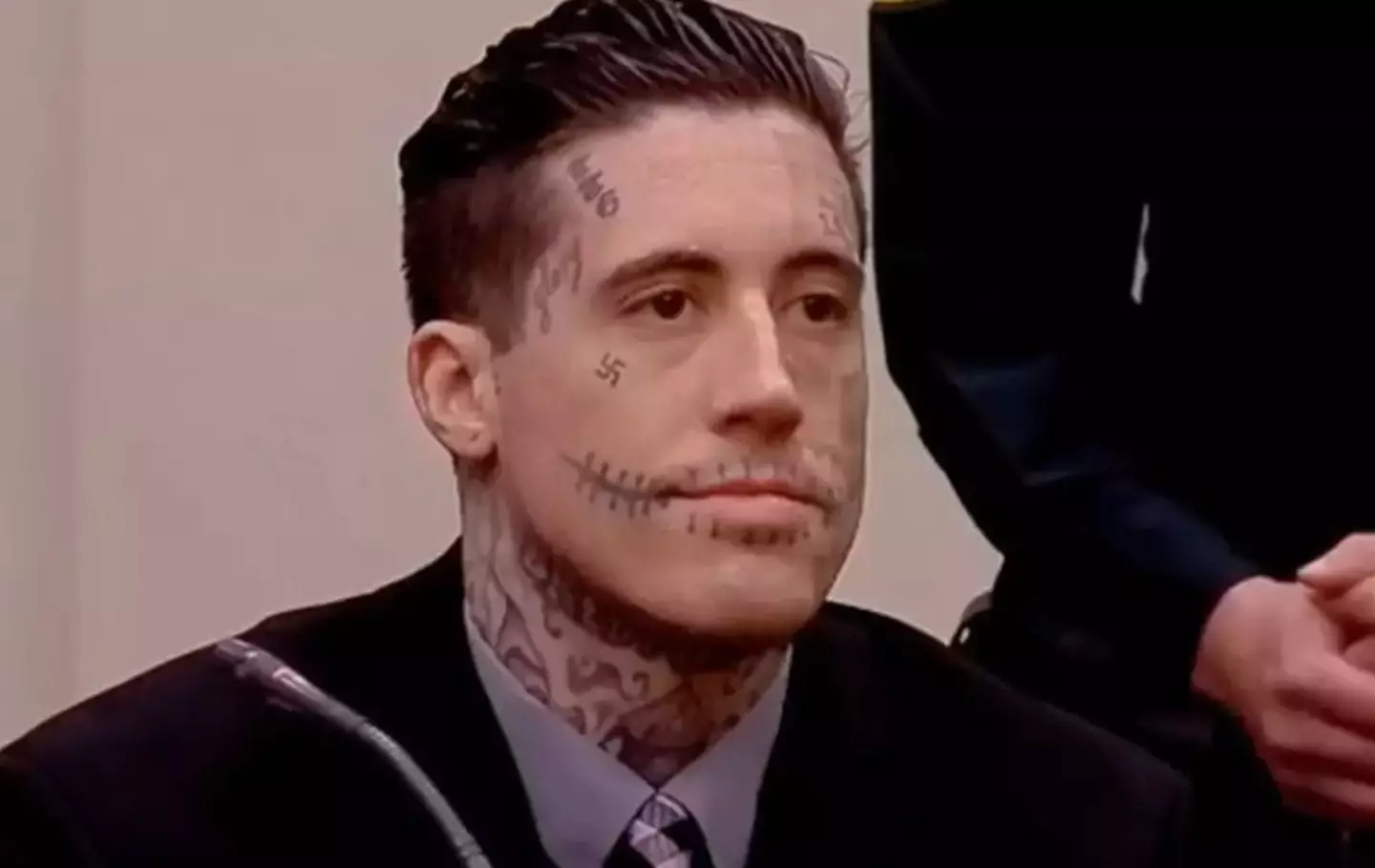 The killer sported an array of face tattoos while in court last year (Cape Coral Police Department)