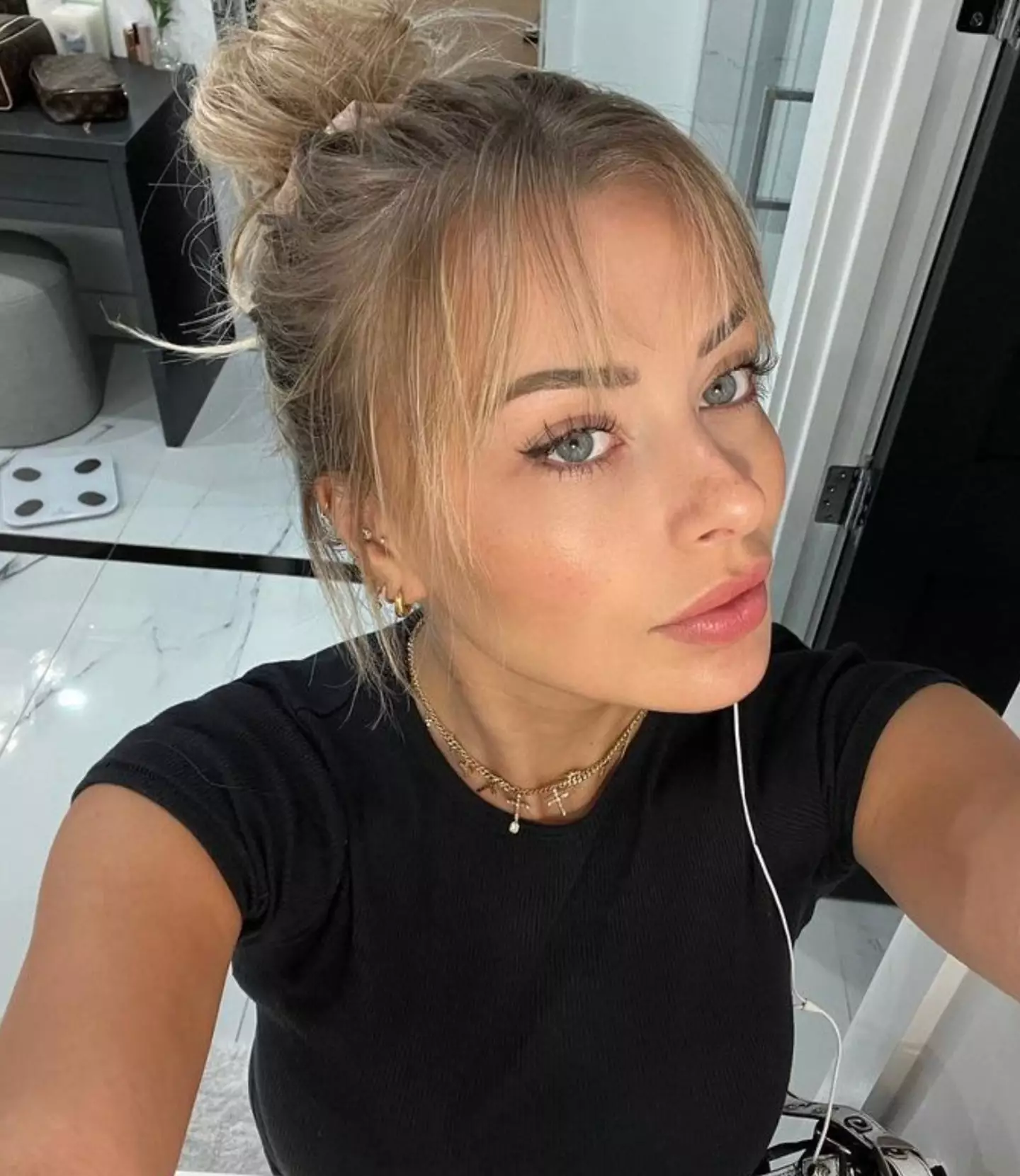 She's currently bringing in more than £300,000 a month on OF, which is helping her build her dream home (Instagram/@corinnakopf)