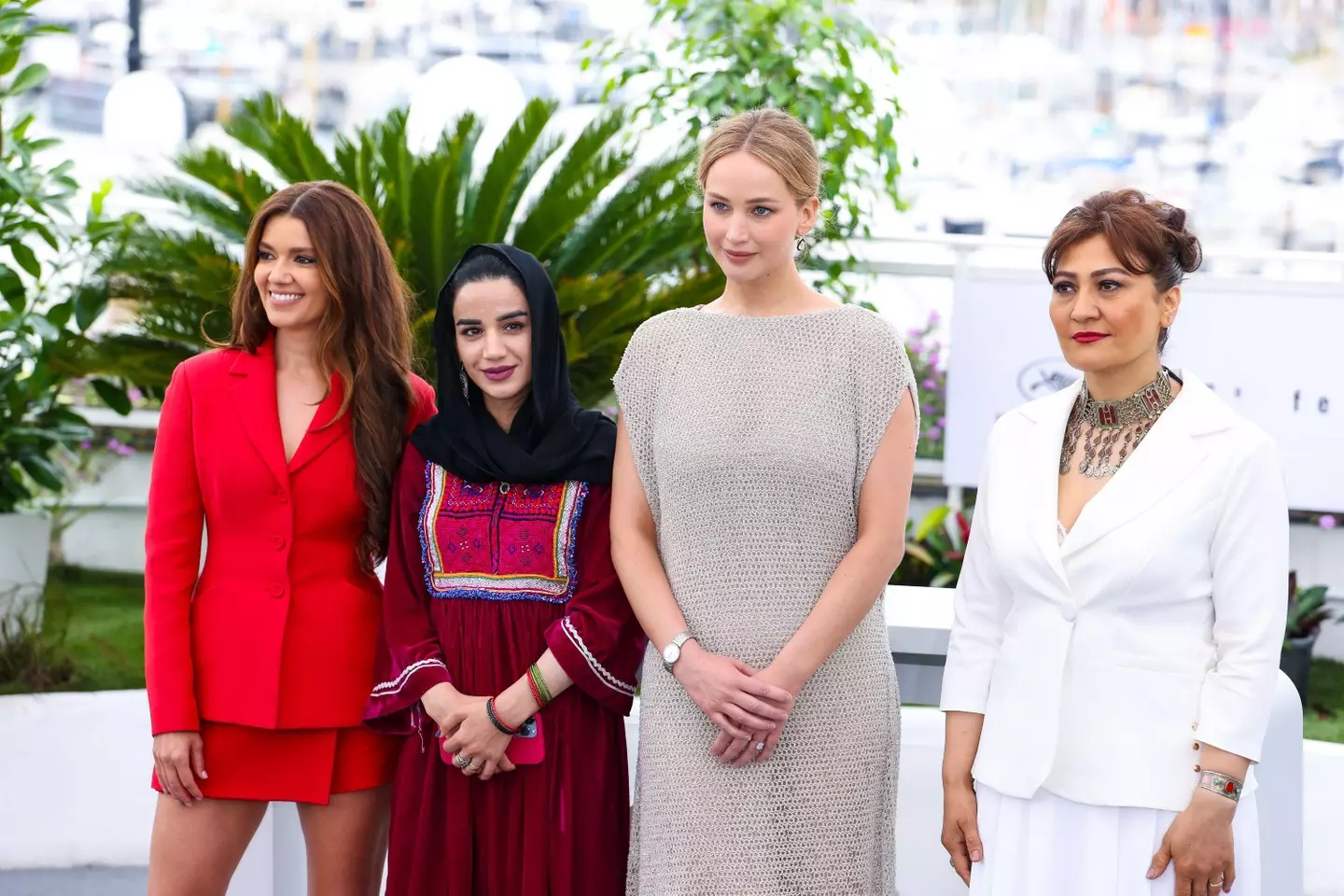 Jennifer Lawrence with the creators of Bread and Roses at Cannes.