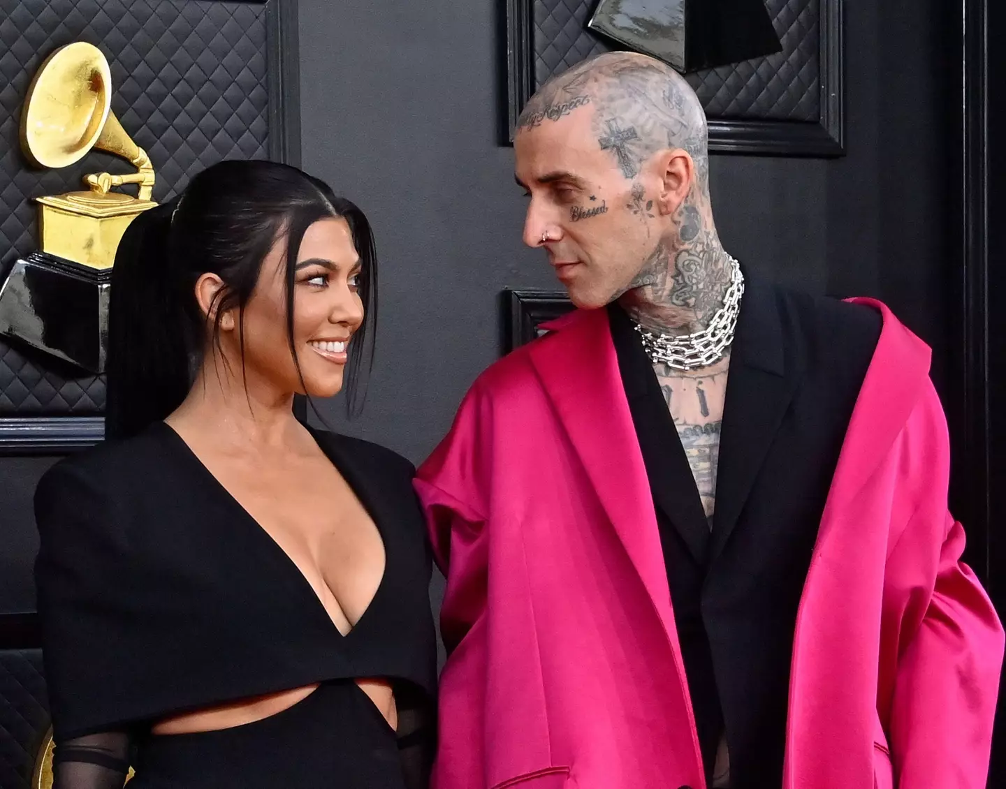 Kourtney Kardashian and Travis Barker arrive for the 64th annual Grammy Awards at the MGM Grand Garden Arena in Las Vegas, Nevada.