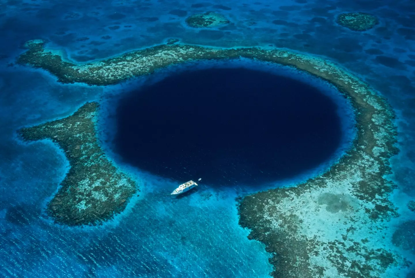 The Great Blue Hole is located off the coast of Belize.