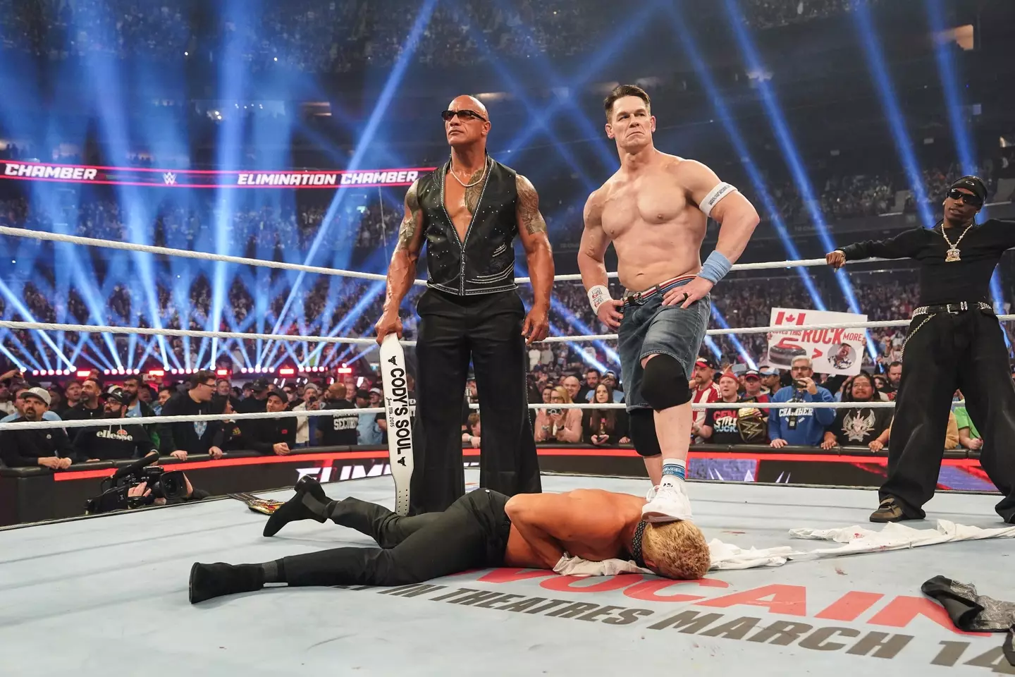 Cena recently allied himself with The Rock in a shocking heel turn. Also for some reason Travis Scott was there (WWE via Getty Images)